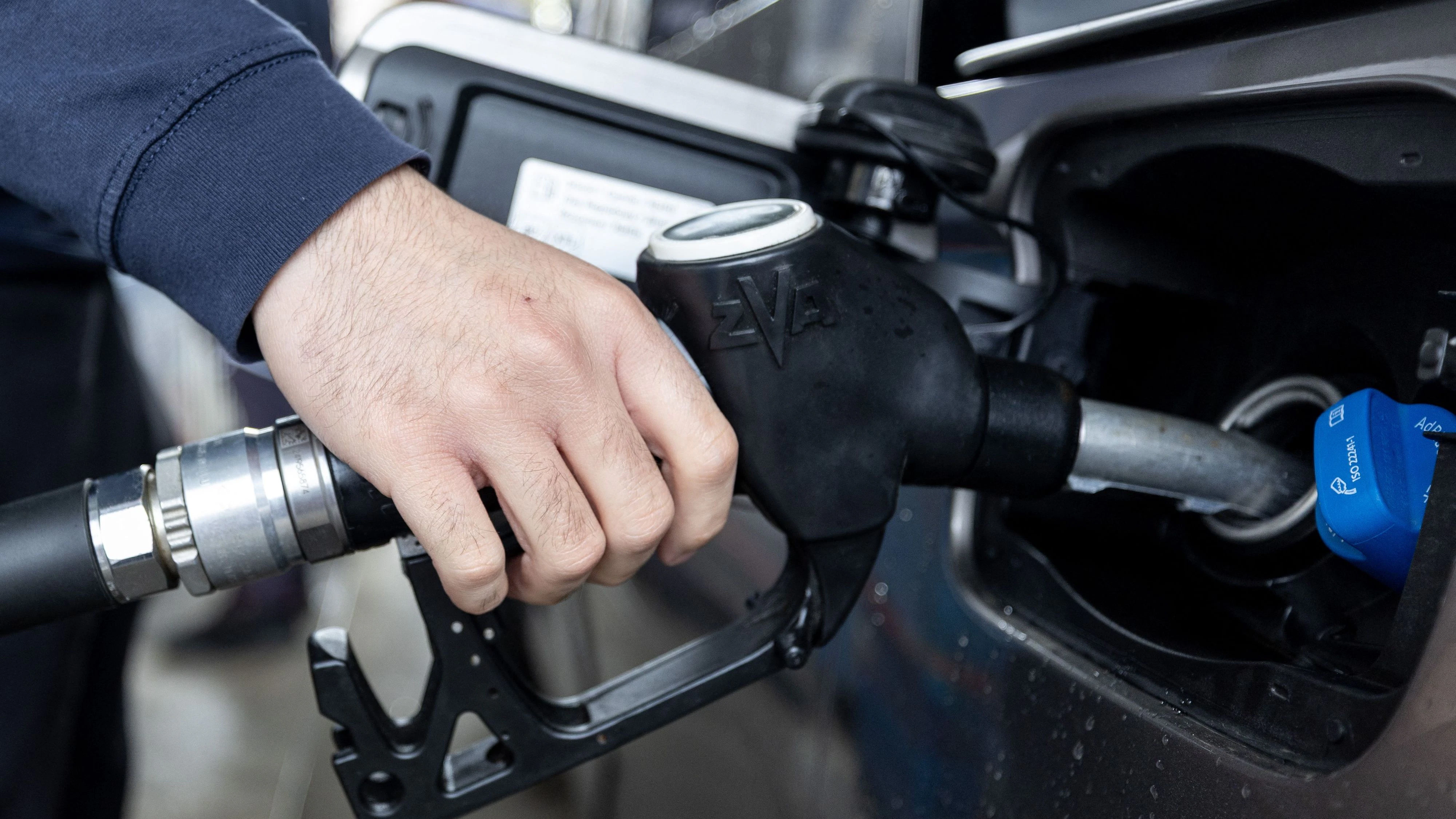 A customer refuels his car at a gas station in downtown Zagreb, Croatia on March 23, 2026. EU Member states retain a large degree of independence from Brussels in influencing retail energy prices, and some have already moved to contain the fallout from conflict in the Middle East, as Croatia and Hungary have announced fuel price caps. (Photo by MARKO PERKOV / AFP)