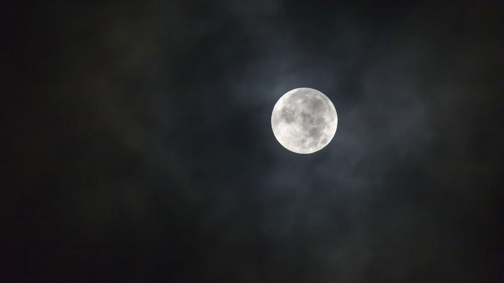 Close up of full moon in cloud