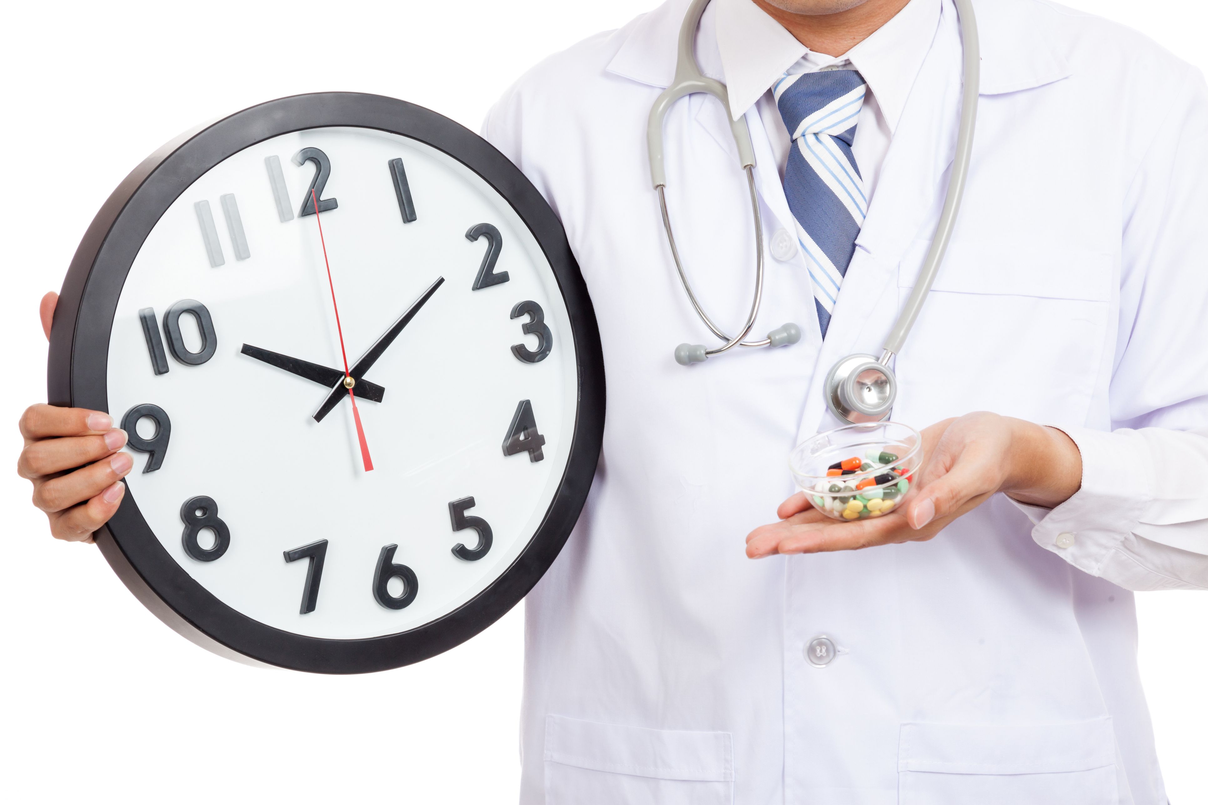 Close up of Asian male doctor show a clock and pills