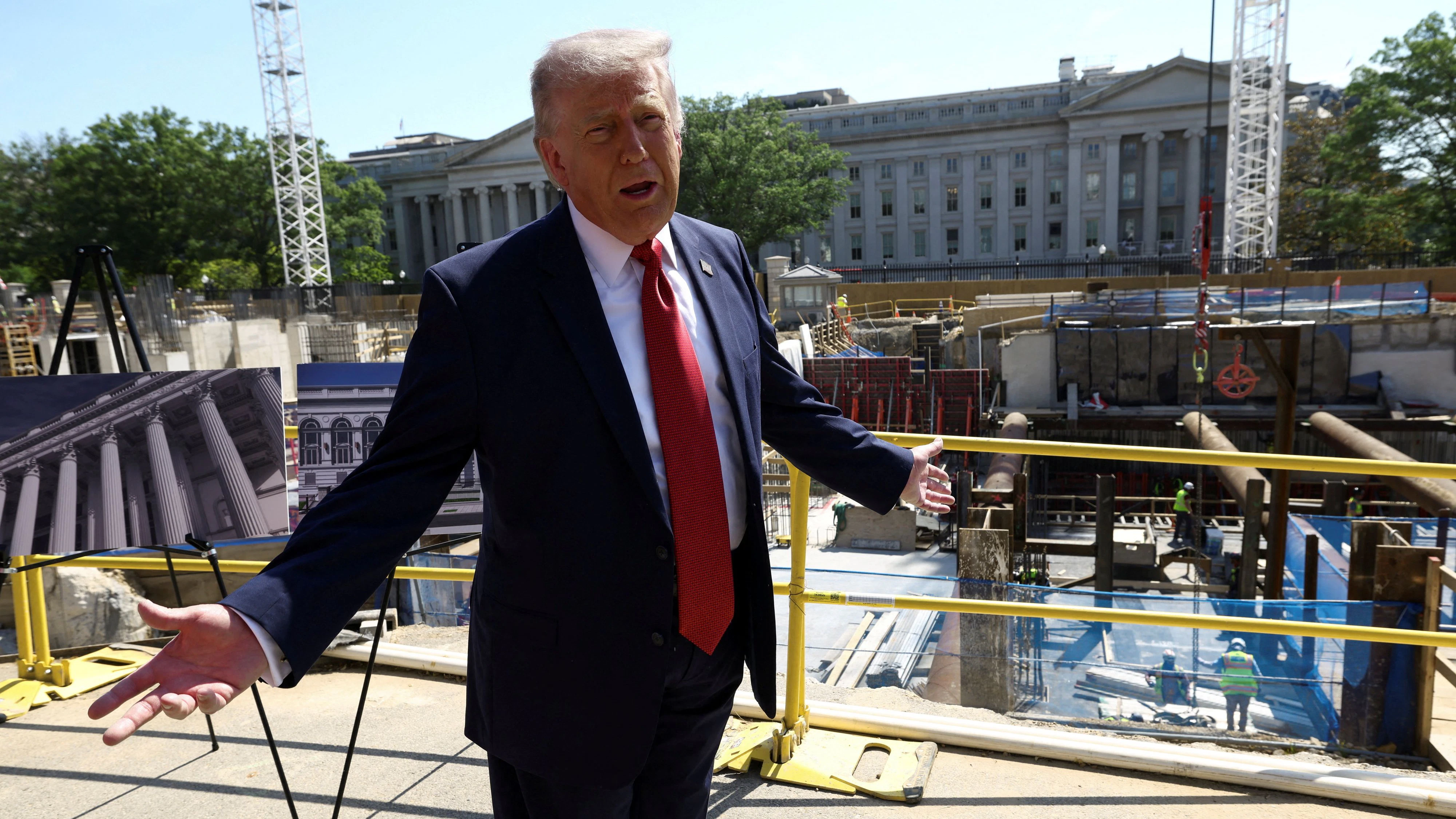 U..S. President Donald Trump gestures at the site of ongoing construction of the planned White House ballroom in Washington, D.C., U.S., May 19, 2026. REUTERS/Kevin Lamarque       TPX IMAGES OF THE DAY     