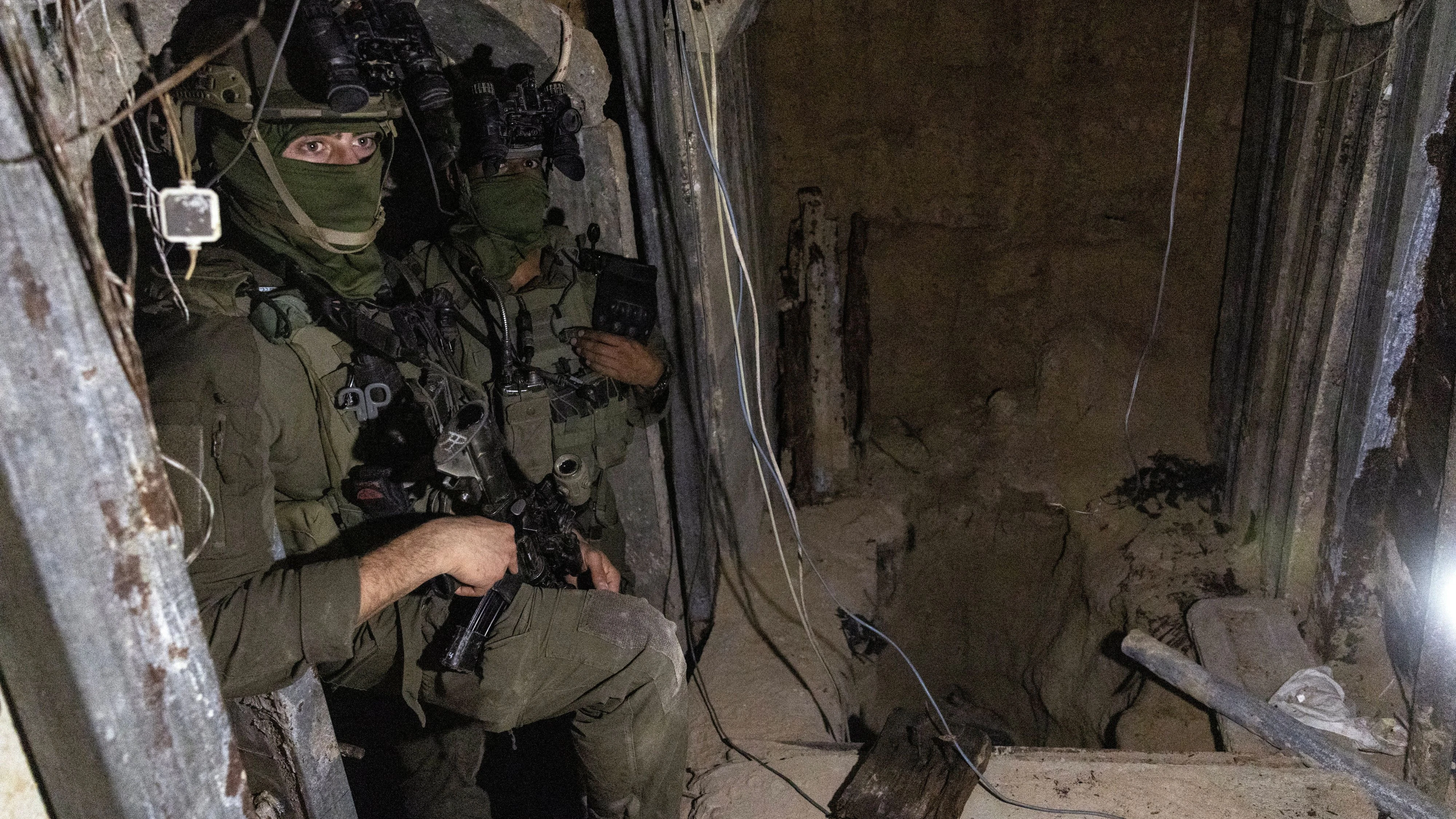 Israeli soldiers in a tunnel where, according to Israel's military, Hamas militants held the body of Israeli officer Hadar Goldin, in Rafah in the southern Gaza Strip, December 8, 2025. The tunnel is part of a ten kilometer tunnel network that reaches the area of Khan Younis, according to the Israeli military. Goldin was killed during the 2014 Israel-Gaza war. His remains were returned in November as part of a ceasefire between Israel and Hamas. REUTERS/Nir Elias    REUTERS EDITOR'S NOTE: PHOTOGRAPHS WERE REVIEWED BY THE IDF AS PART OF THE CONDITIONS OF THE EMBED. NO PHOTOS WERE REMOVED