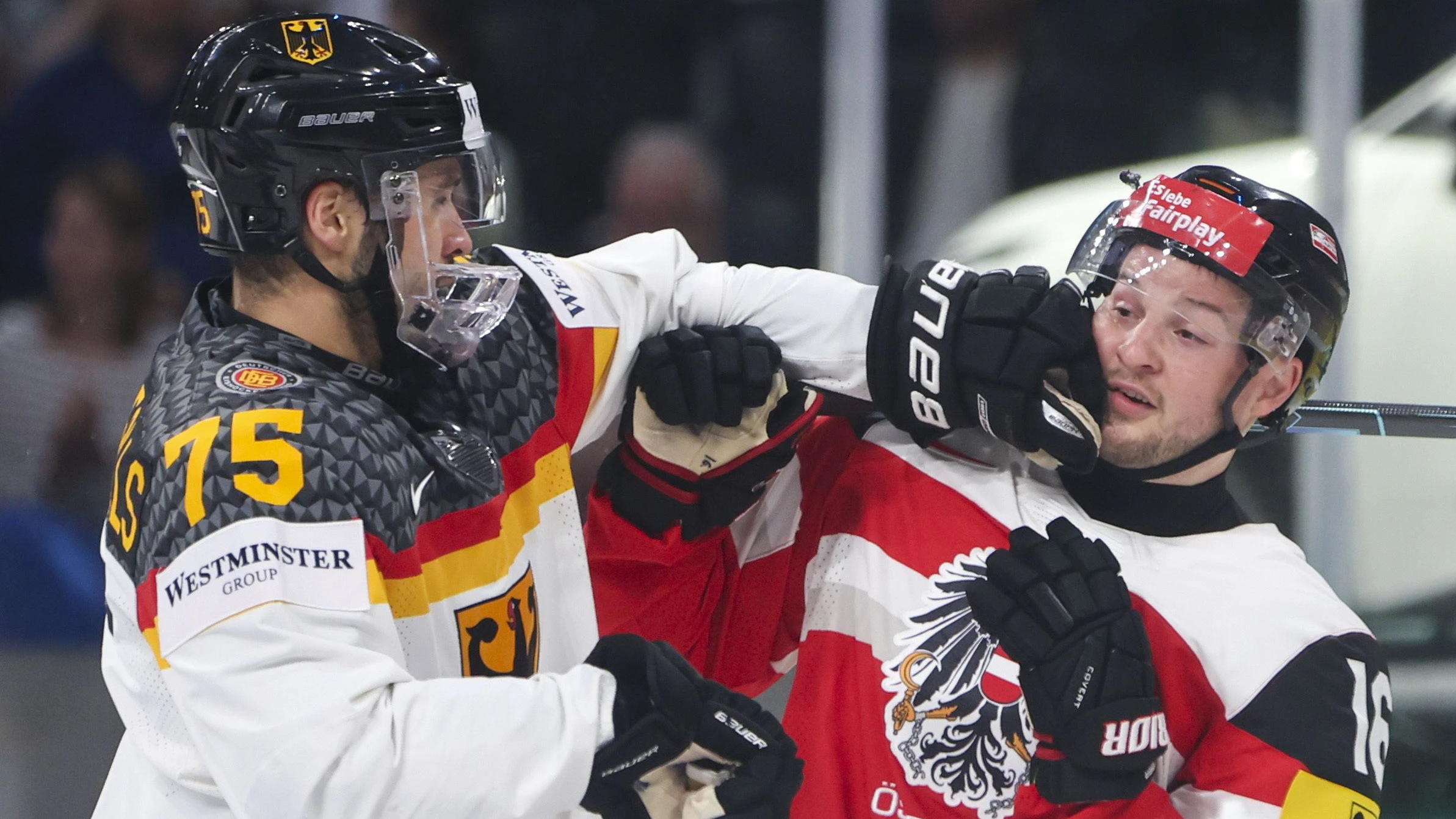 ZURICH,SWITZERLAND,23.MAY.26 - ICE HOCKEY - IIHF Ice Hockey World Championship 2026, group stage, Austria vs Germany. Image shows Samuel Dove-McFalls (GER) and Dominic Zwerger (AUT) Photo: GEPA pictures/ Matic Klansek