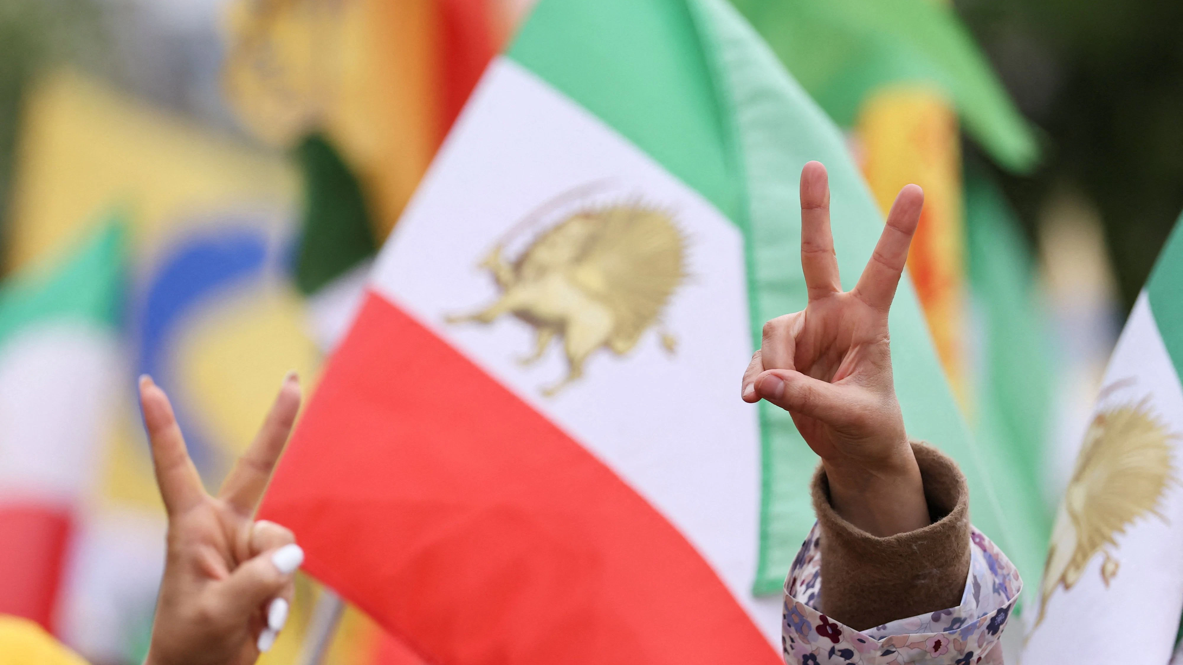 Demonstrators gather on the Trocadero square to call for peace and freedom, on the day delegations from the United States and Iran hold peace talks in Islamabad, in Paris, France, April 11, 2026.   REUTERS/Christian Hartmann