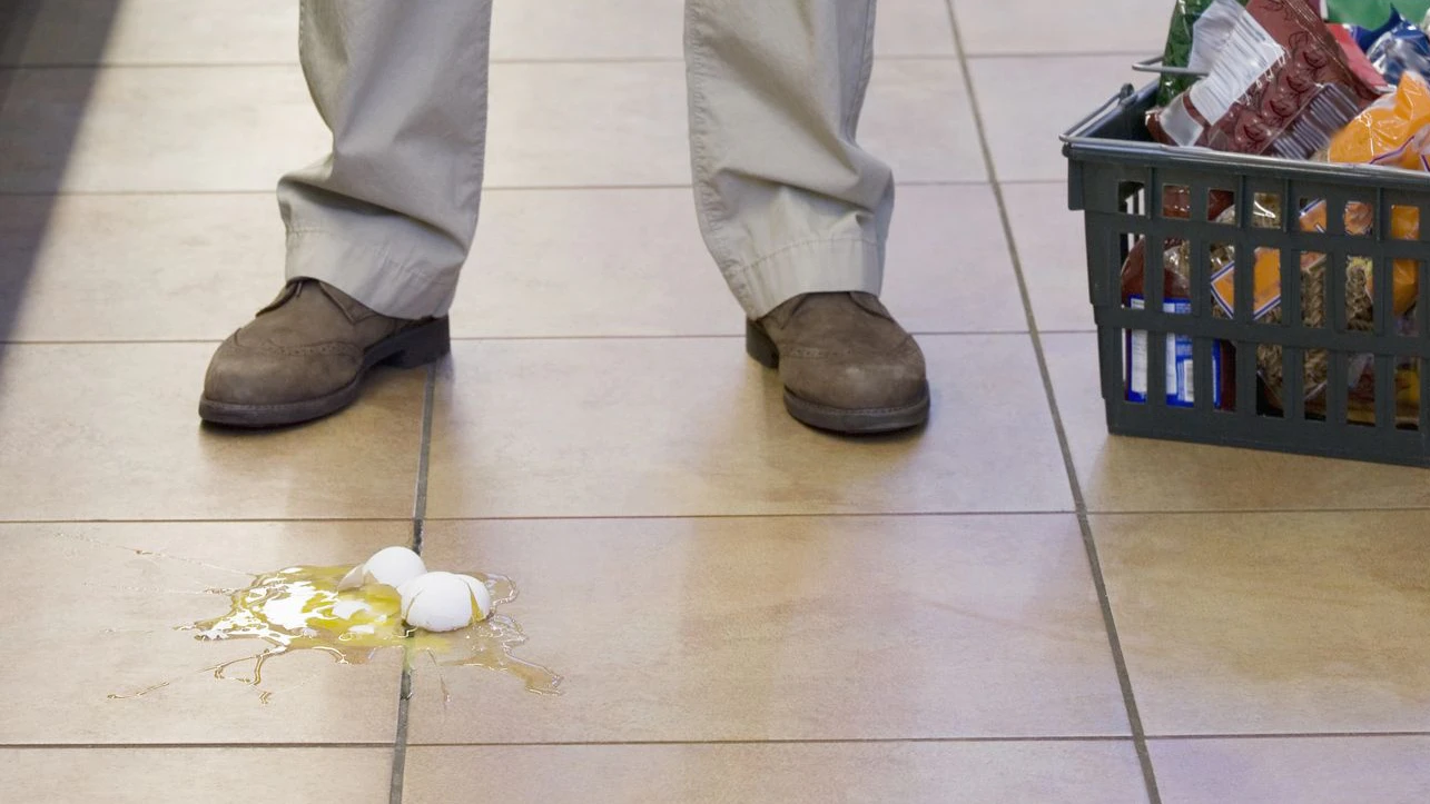 Man dropping eggs in grocery store
