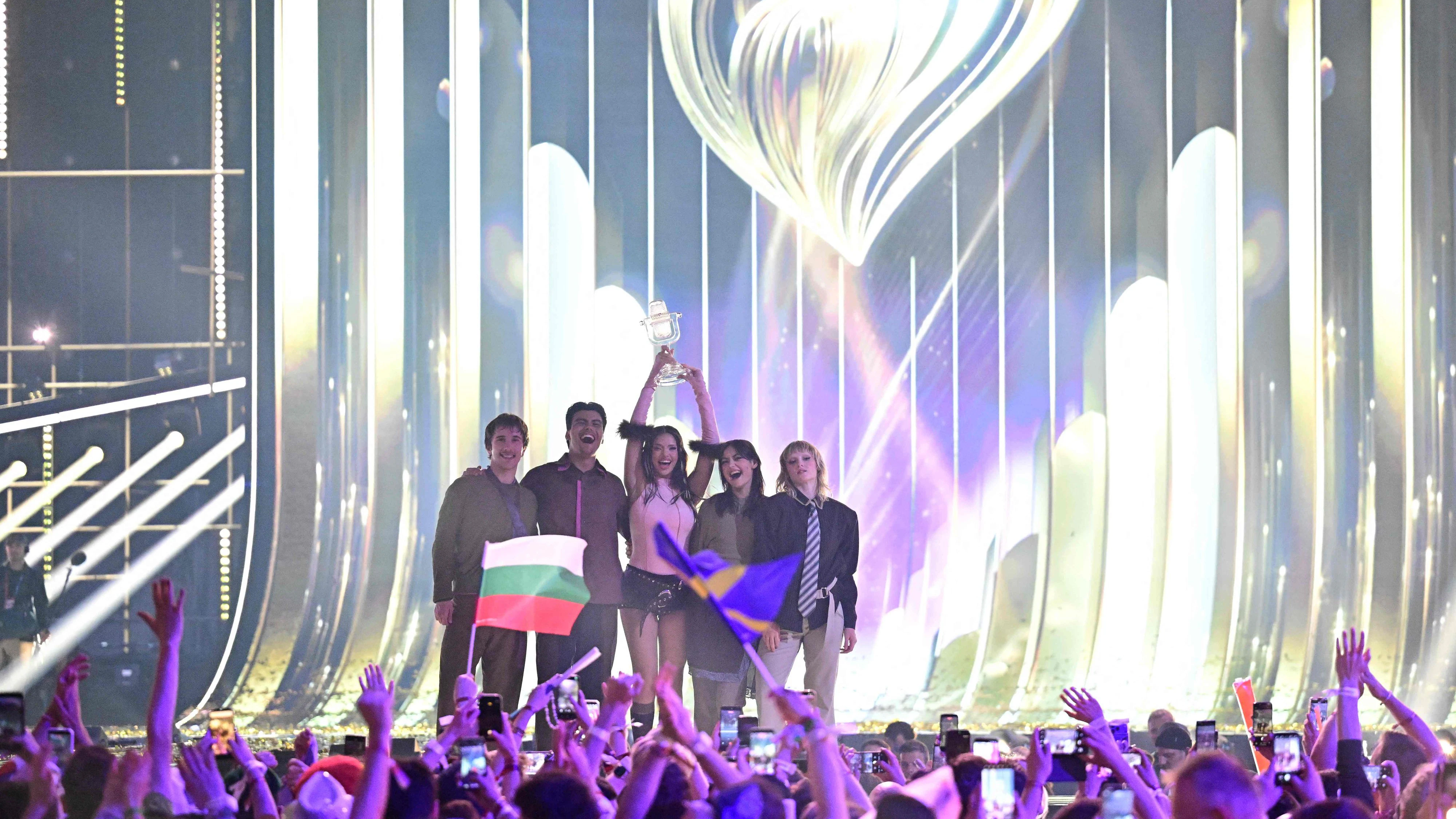 Winner Darina Nikolaeva Yotova, aka Dara and representing Bulgaria with the song 'Bangaranga' (C), celebrates with the trophy after the final of the Eurovision Song Contest 2026 (ESC) at Wiener Stadthalle in Vienna, Austria on May 16, 2026. (Photo by Tobias SCHWARZ / AFP)