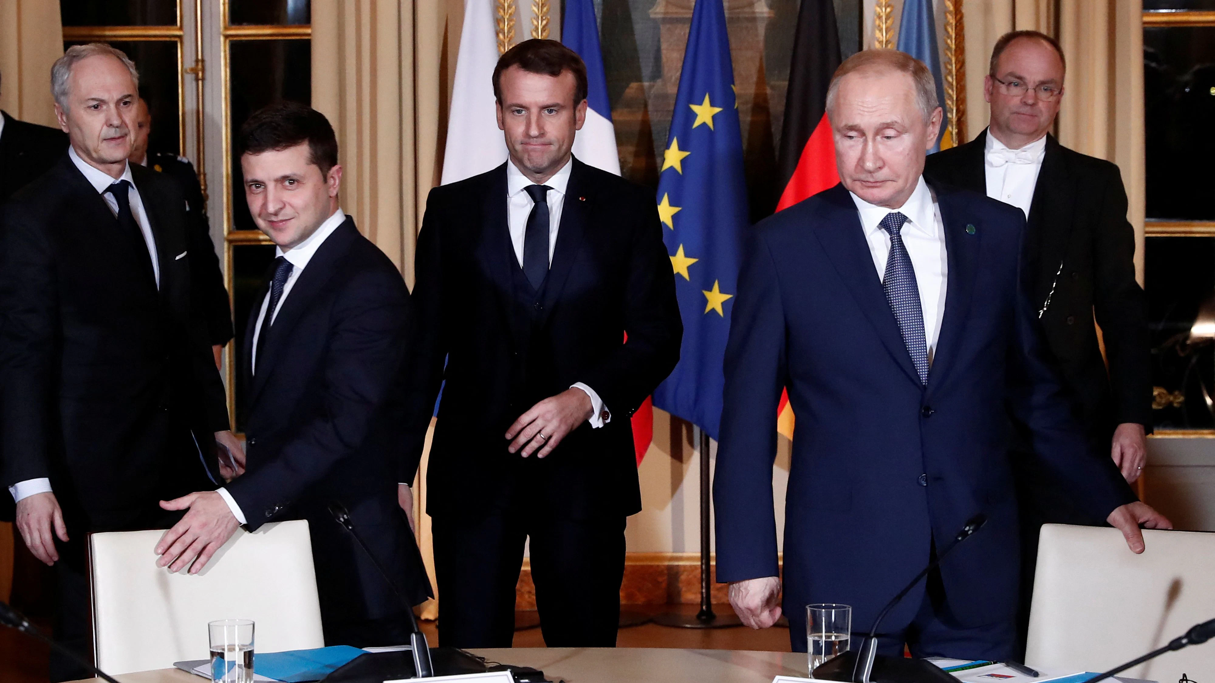 French President Emmanuel Macron, Russian President Vladimir Putin and Ukrainian President Volodymyr Zelenskiy arrive for a working session during a summit on the conflict in Ukraine at the Elysee Palace in Paris, France December 9, 2019. Ian Langsdon/Pool via REUTERS