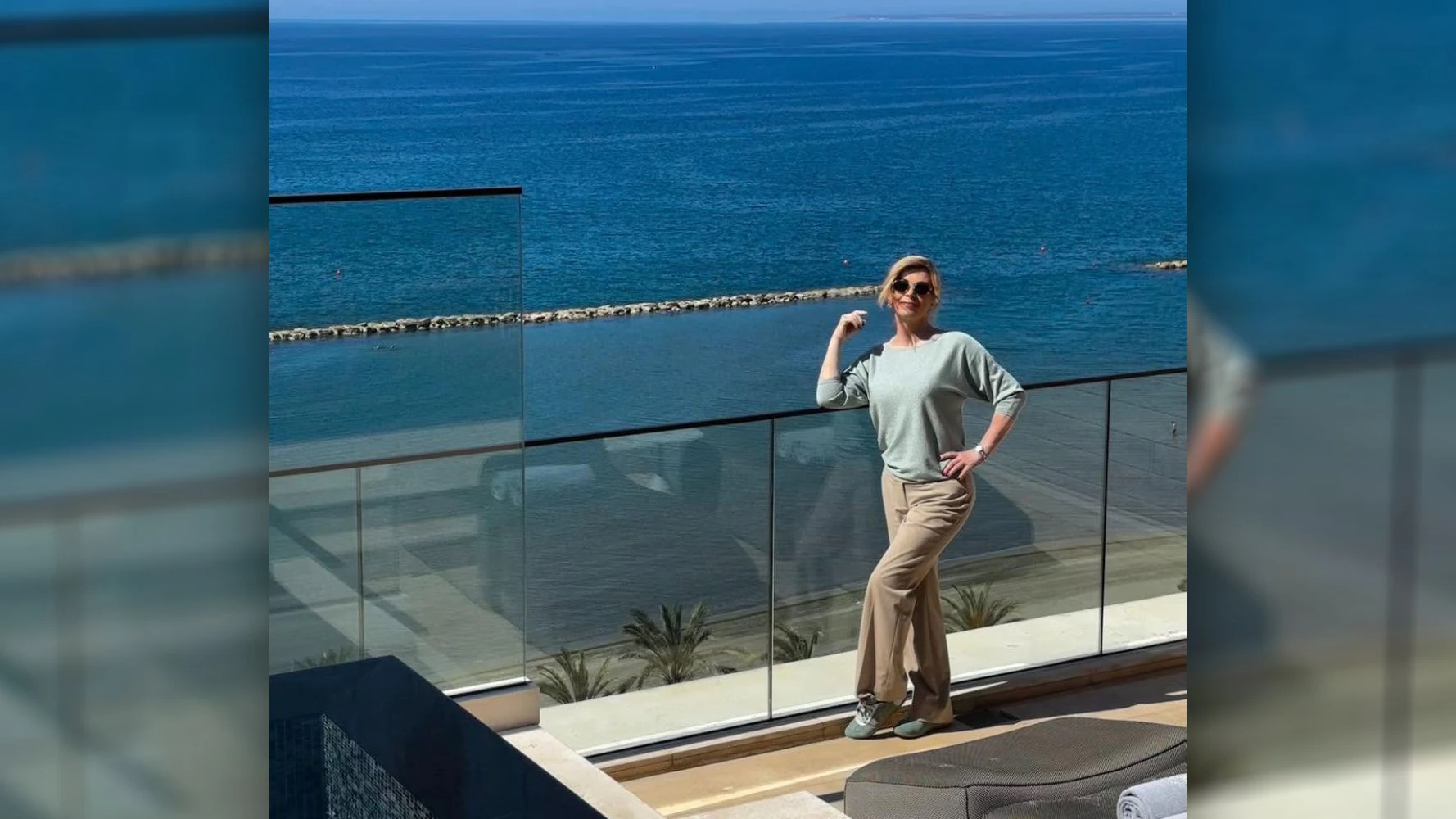 Kolinda Grabar-Kitarovic zeigt Urlaubsfotos.