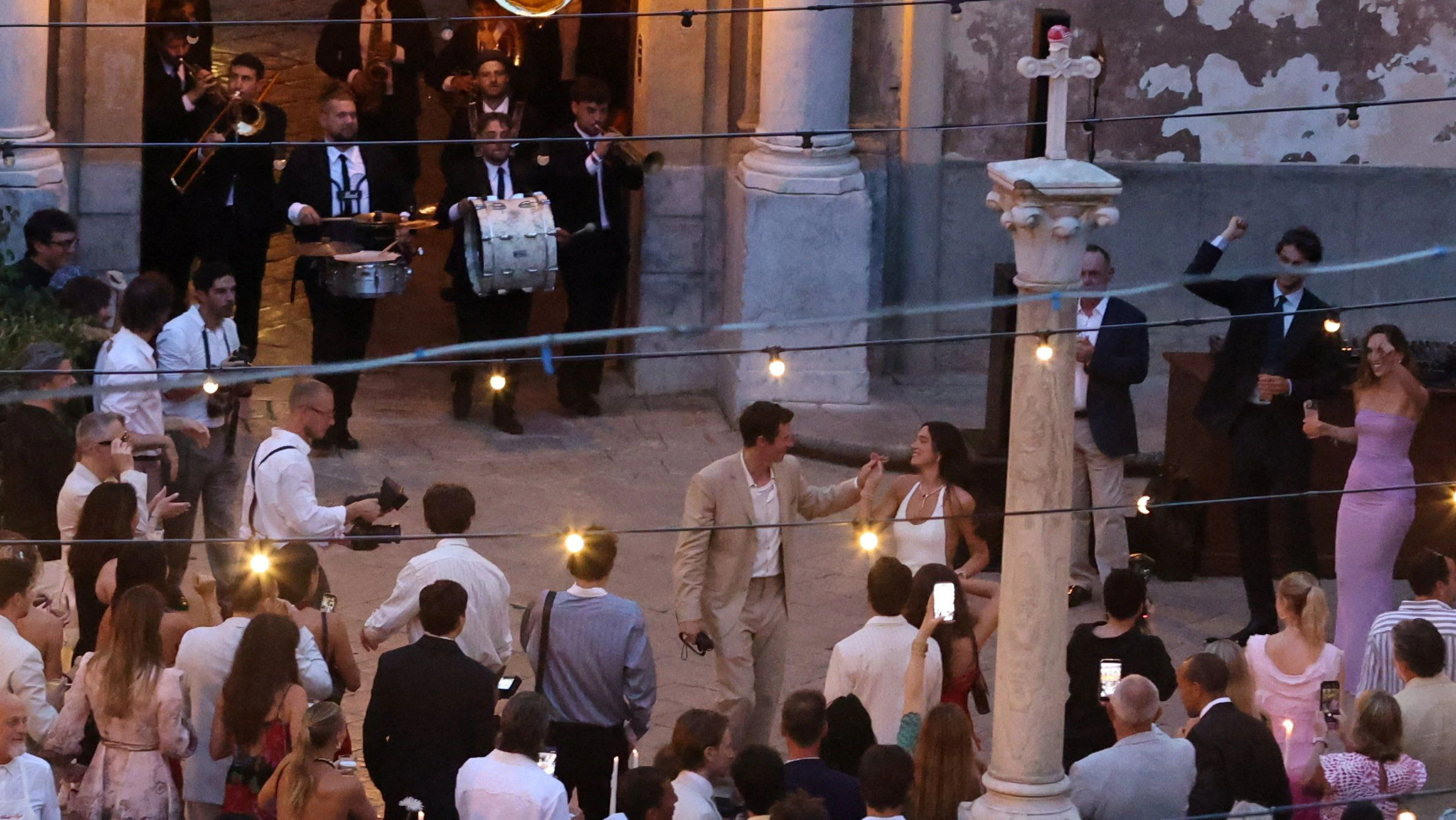 Singer Dua Lipa dances with her husband, actor Callum Turner, during wedding festivities following their marriage, in Palermo, Italy, June 5, 2026. REUTERS/Igor Petyx