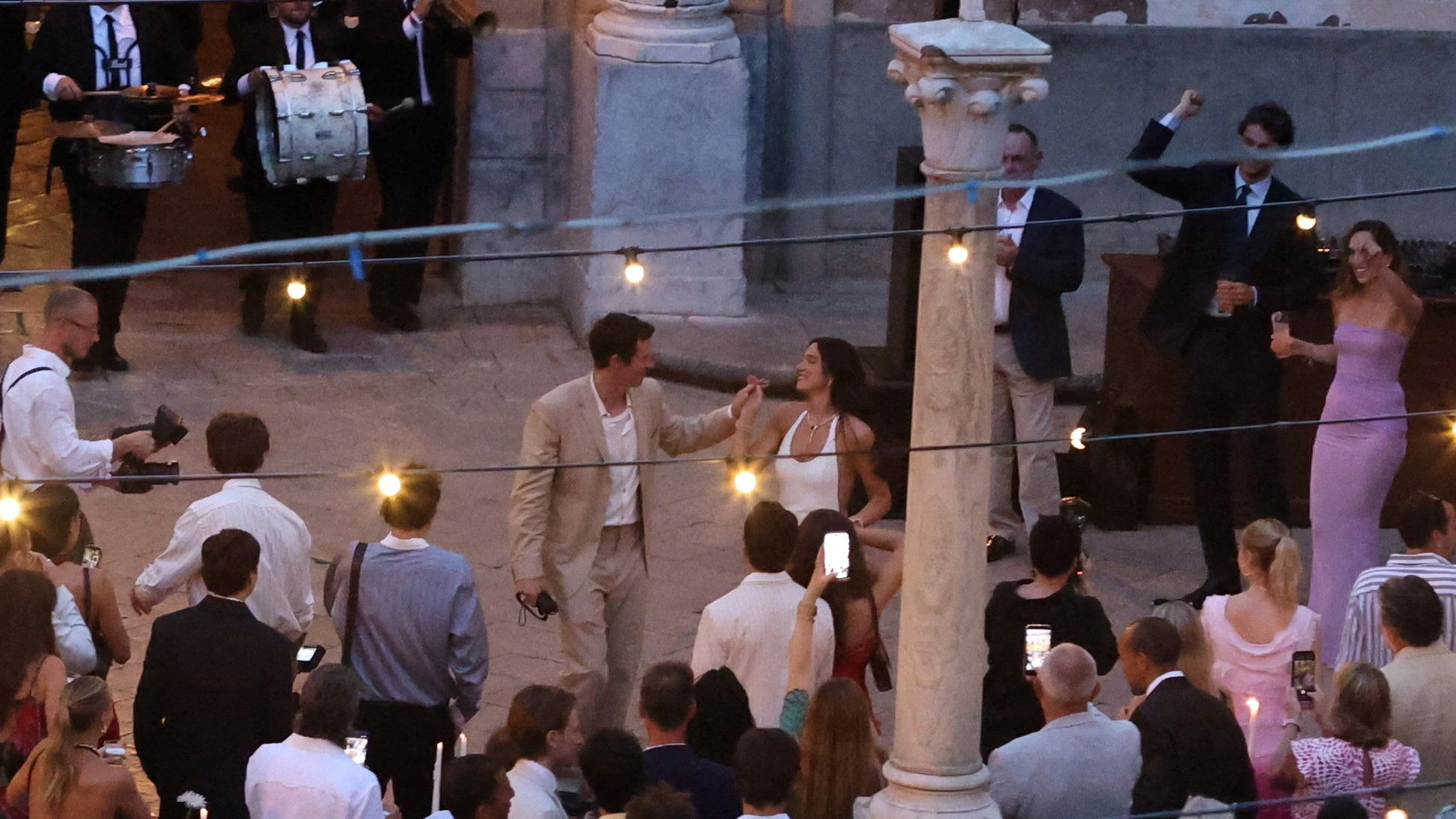 Singer Dua Lipa dances with her husband, actor Callum Turner, during wedding festivities following their marriage, in Palermo, Italy, June 5, 2026. REUTERS/Igor Petyx