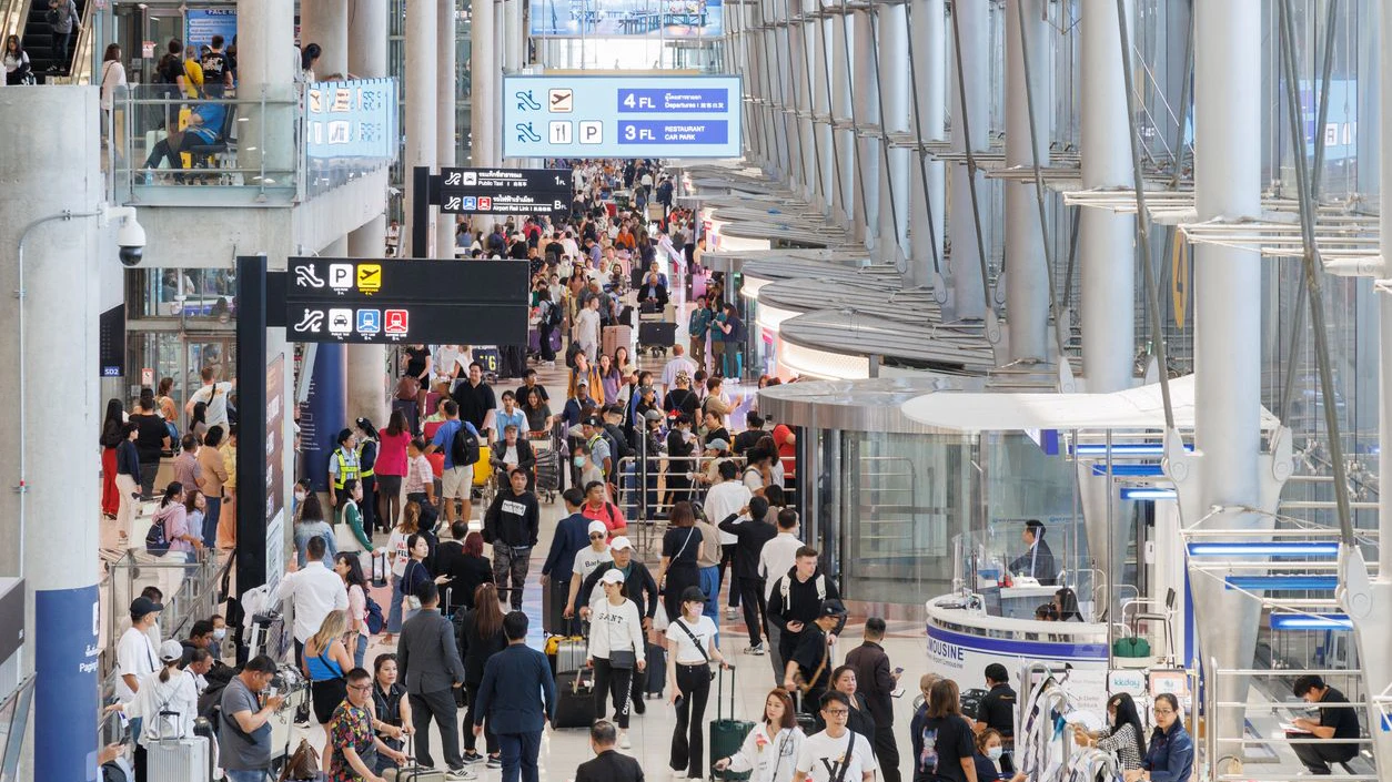 Bangkok, Thailand - April 21, 2024 :  asian and europe travel passengers are arrival at suvarnabhumi airport to travel in thailand. transportation and travel concept