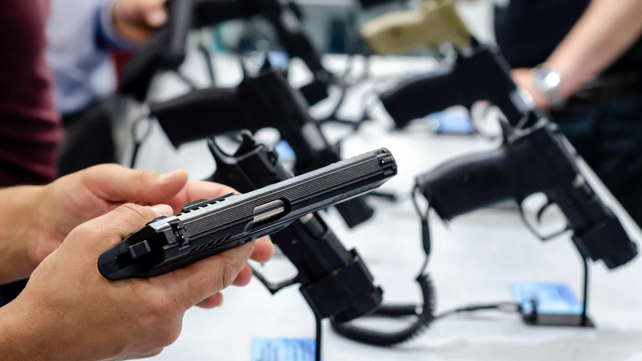 Handgun store shelves. A handgun for sale in the store.