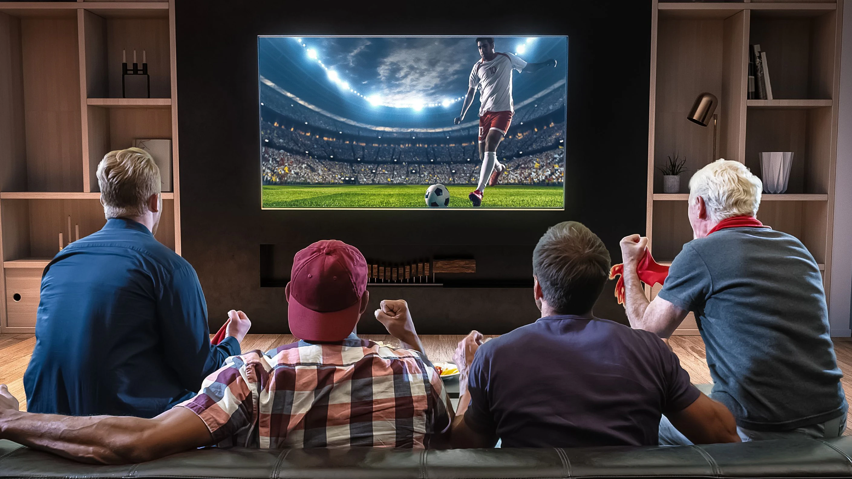 Group of fans are watching a soccer moment on the TV and celebrating a goal, sitting on the couch in the living room. The living room is made in 3D.