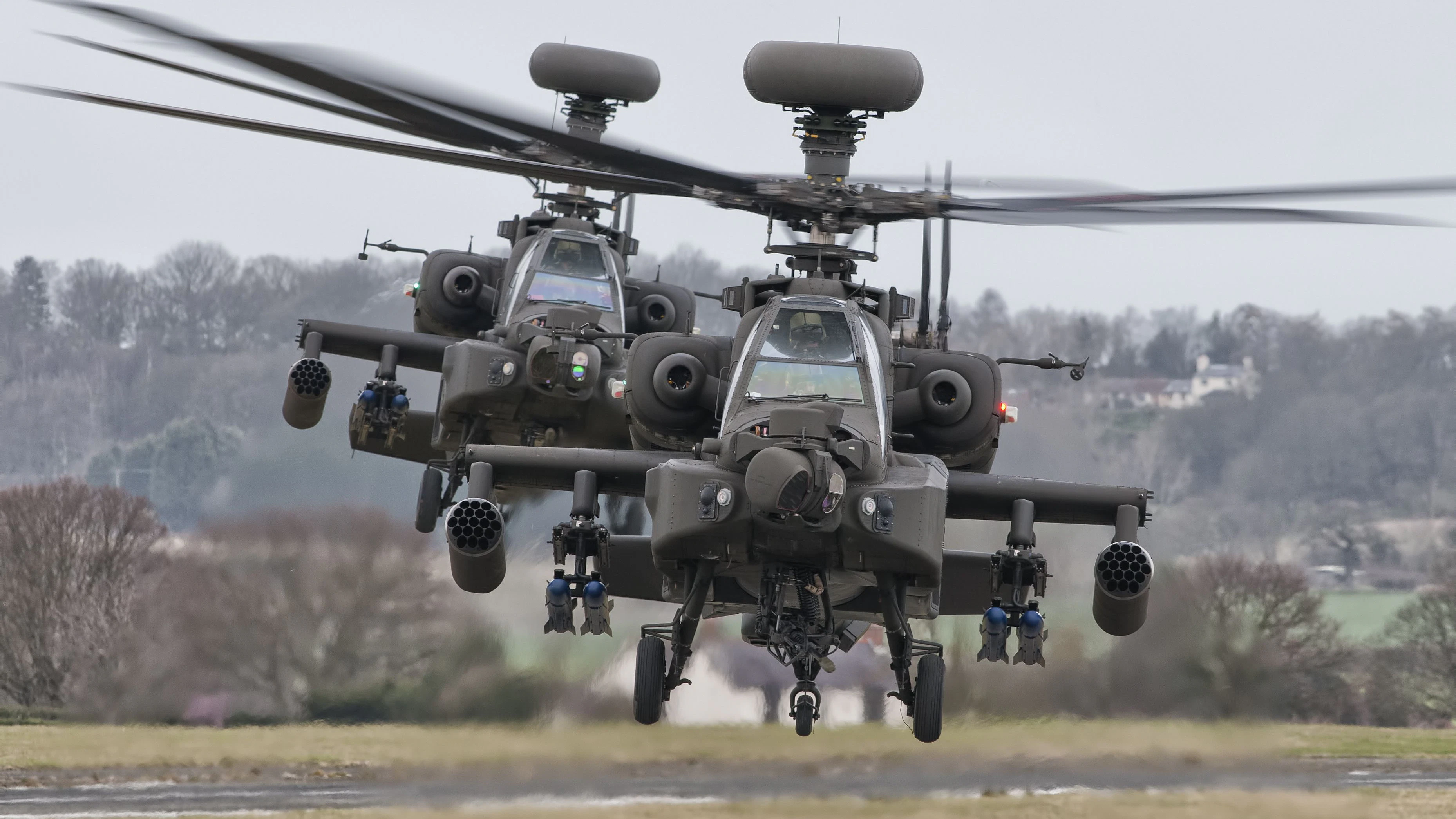 A pair of AAC AgustaWestland Apache's posing for the camera.