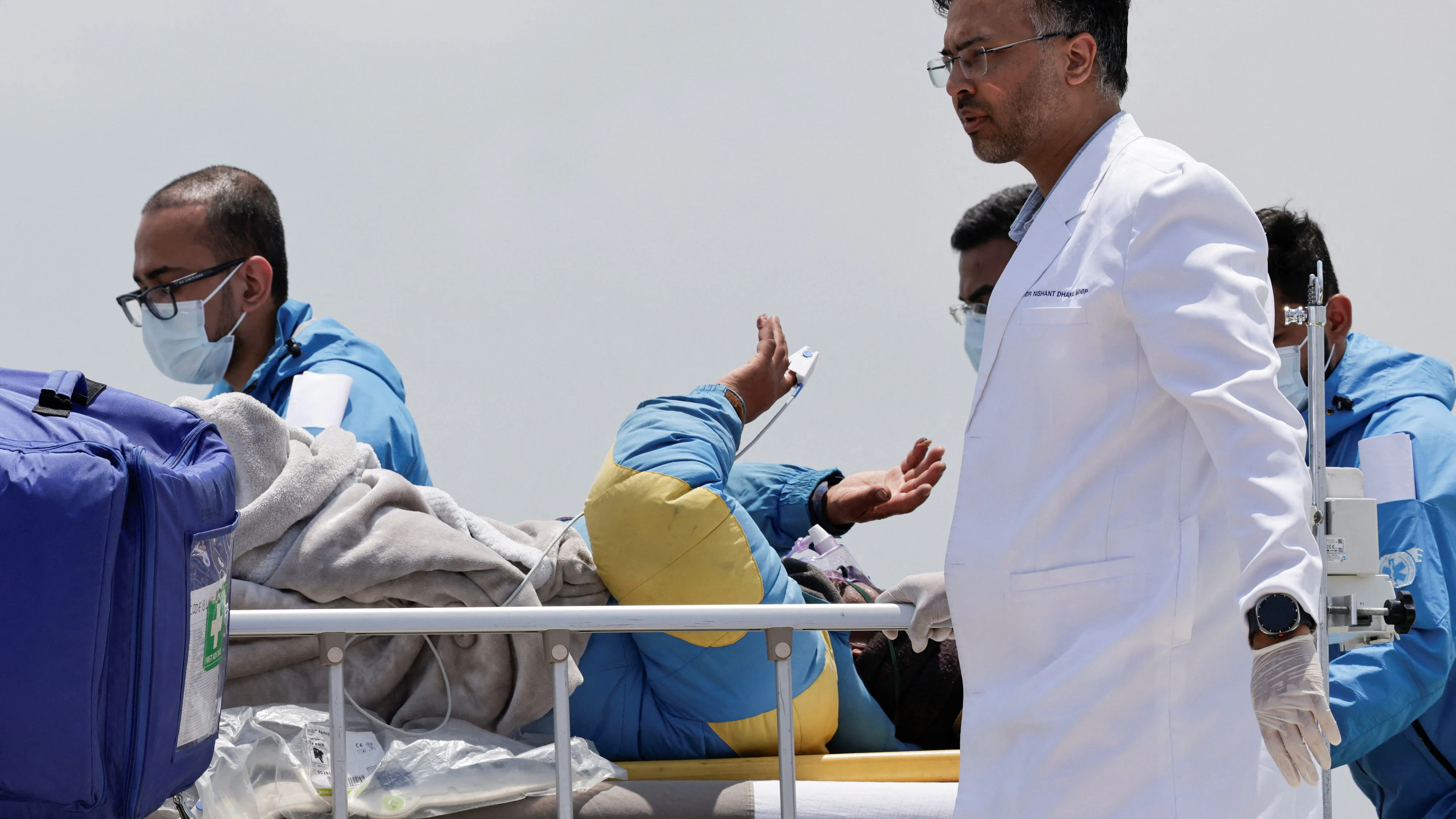 Paramedics transport Dawa Sherpa, who was missing for several days in the Everest region, from the helipad at HAMS Hospital in Kathmandu, Nepal, June 4, 2026. REUTERS/Navesh Chitrakar 
