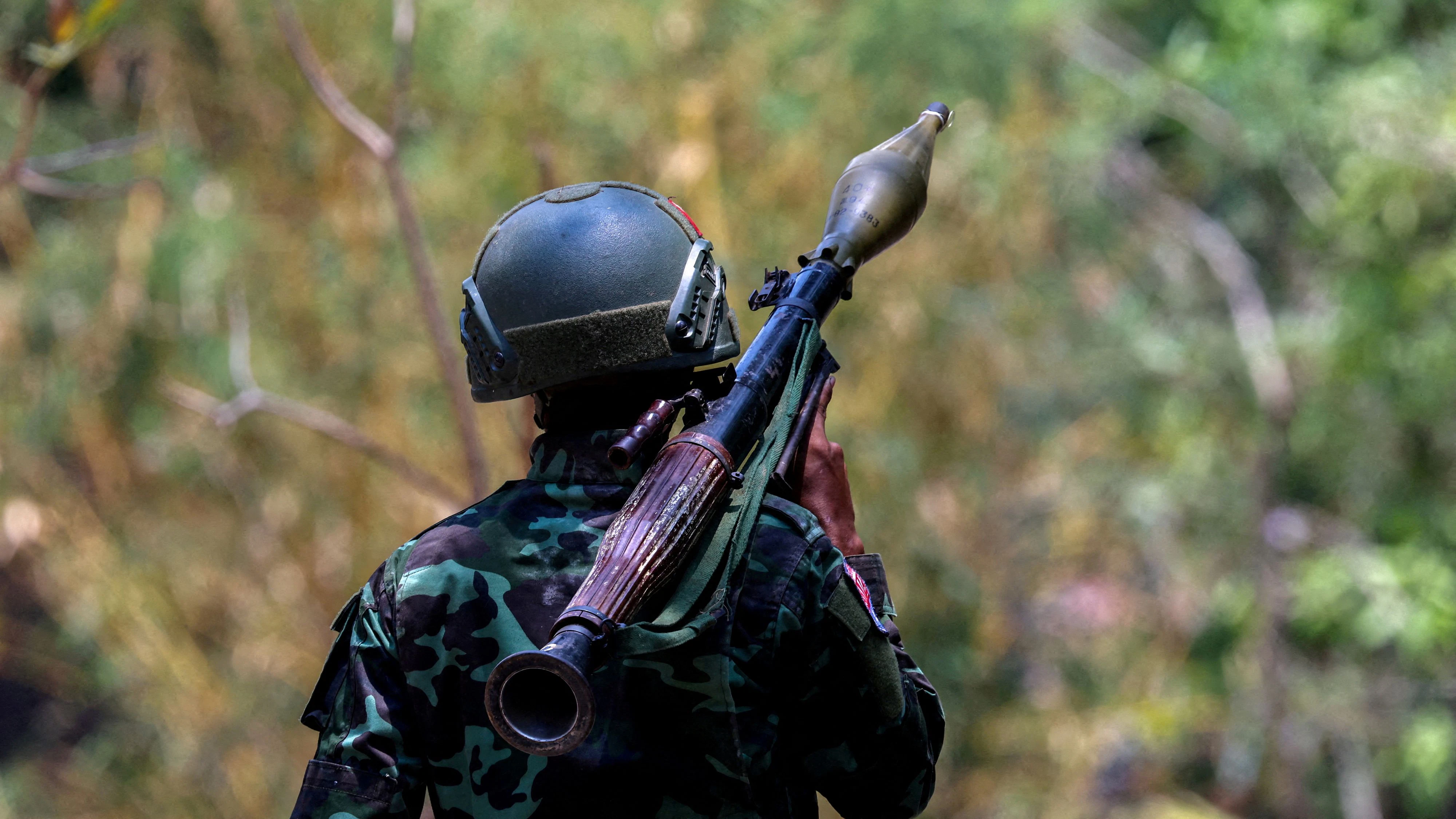 FILE PHOTO: A soldier from the Karen National Liberation Army (KNLA) carries an RPG launcher at a Myanmar military base at Thingyan Nyi Naung village on the outskirts of Myawaddy, the Thailand-Myanmar border town under the control of a coalition of rebel forces led by the Karen National Union, in Myanmar, April 15, 2024. REUTERS/Athit Perawongmetha/File Photo