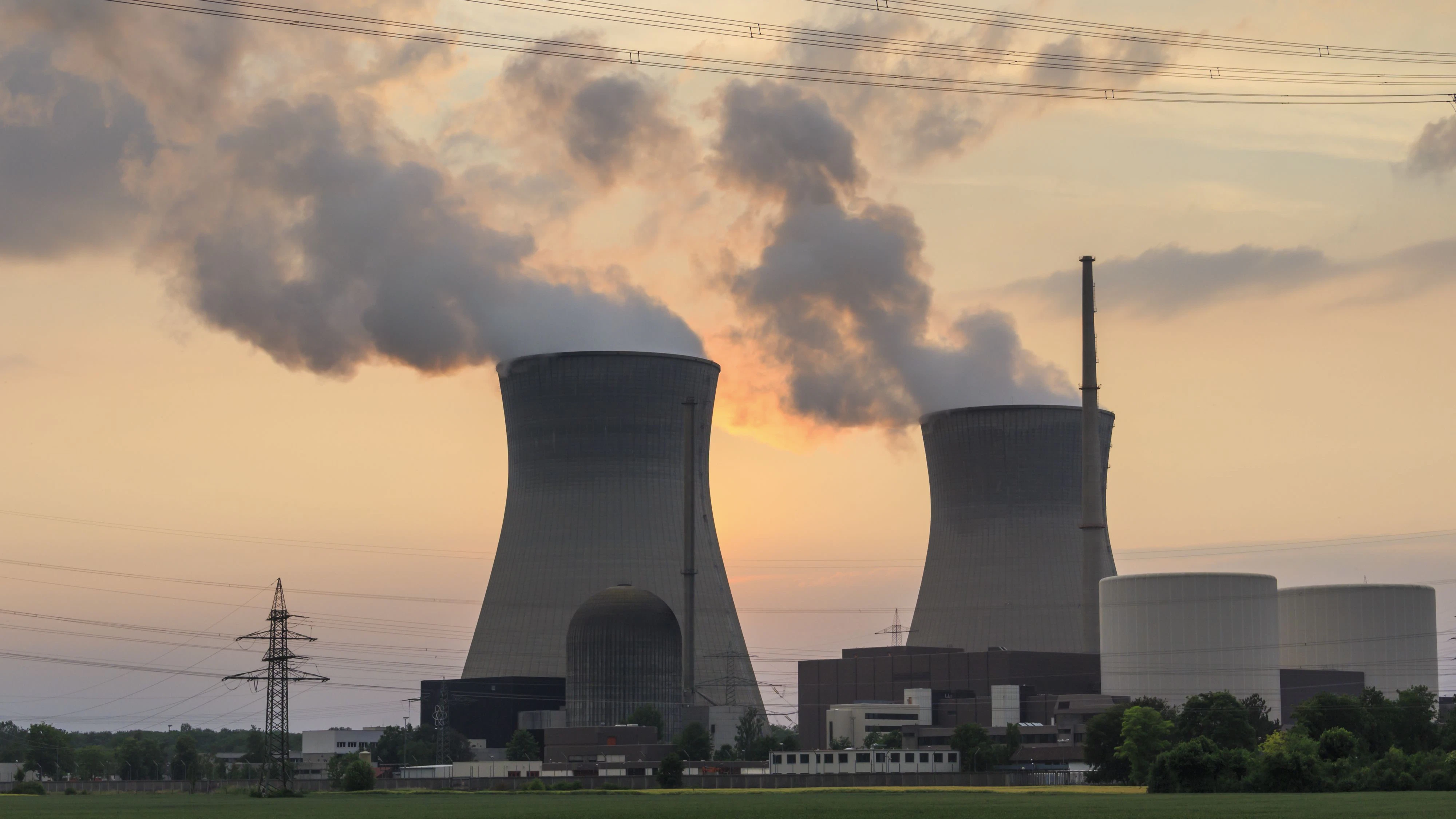 A running nuclear power plant photographed against the evening sky.
