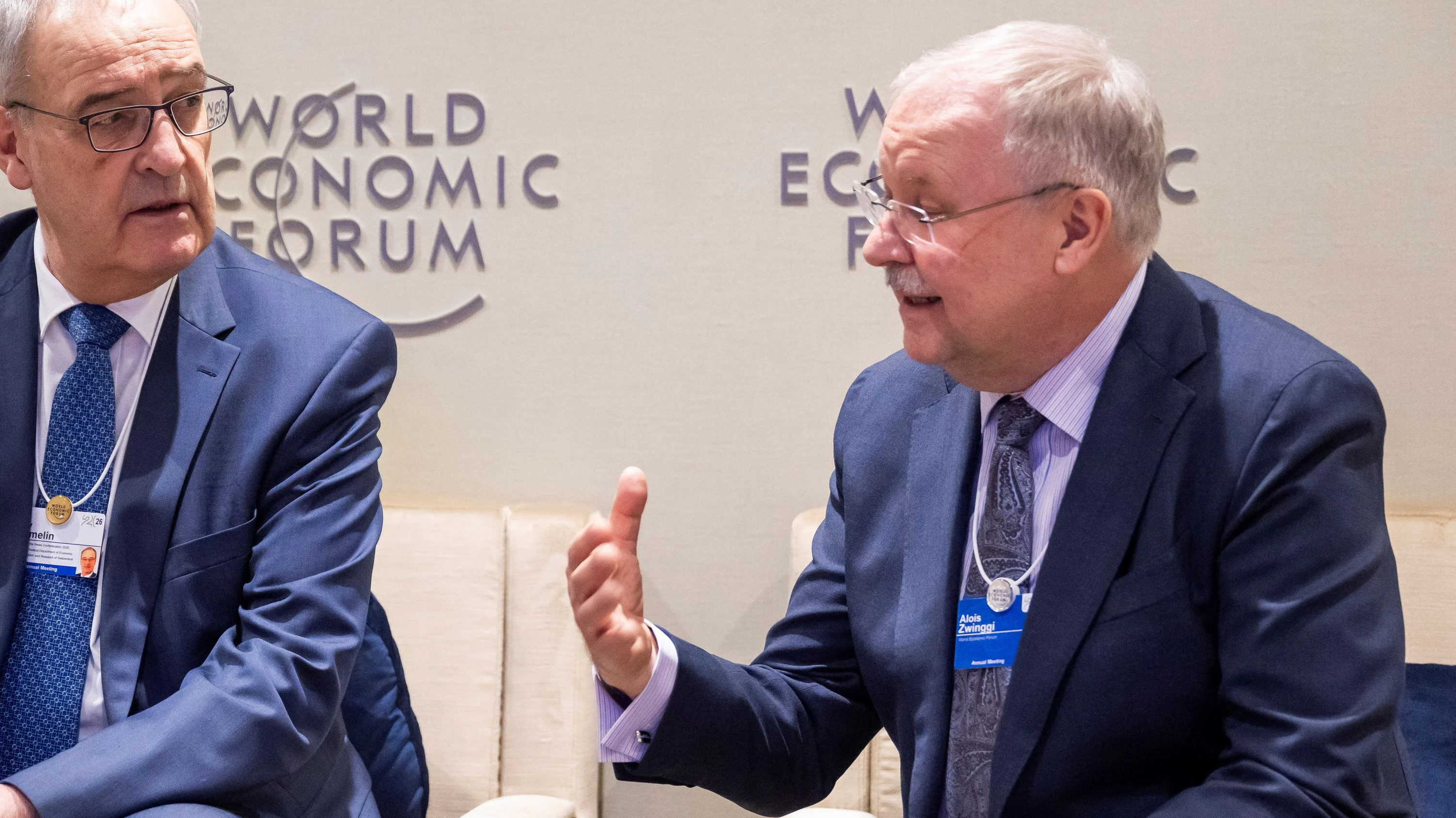 Switzerland's Federal President Guy Parmelin speaks with Alois Zwinggi, Managing Director WEF, prior to a plenary session in the Congress Hall during the 56th annual meeting of the World Economic Forum, in Davos, Switzerland, January 20, 2026. LAURENT GILLIERON/Pool via REUTERS