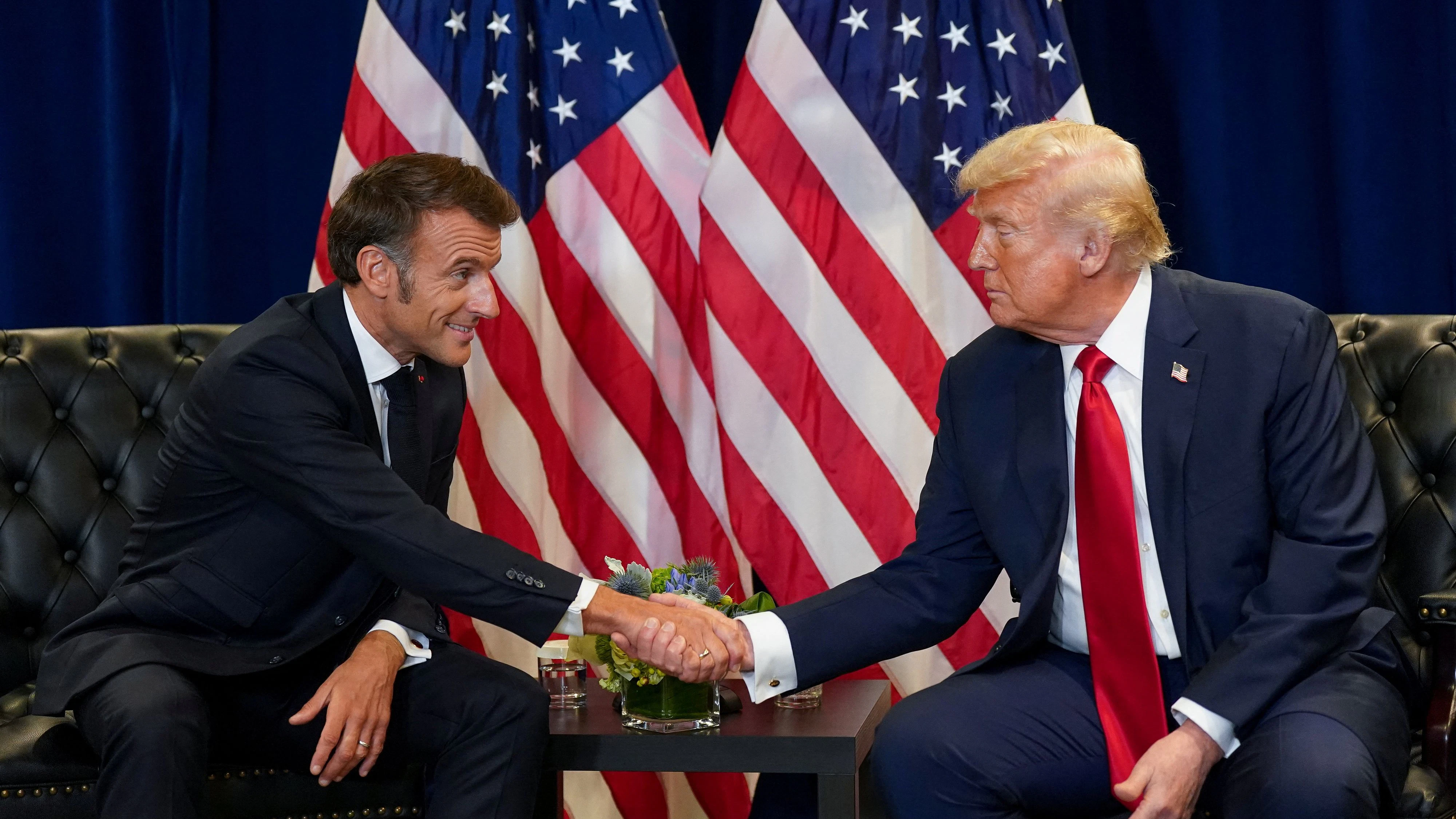 U.S. President Donald Trump shakes hands with French President Emmanuel Macron as they meet during the 80th United Nations General Assembly, in New York City, New York, U.S., September 23, 2025. REUTERS/Al Drago 