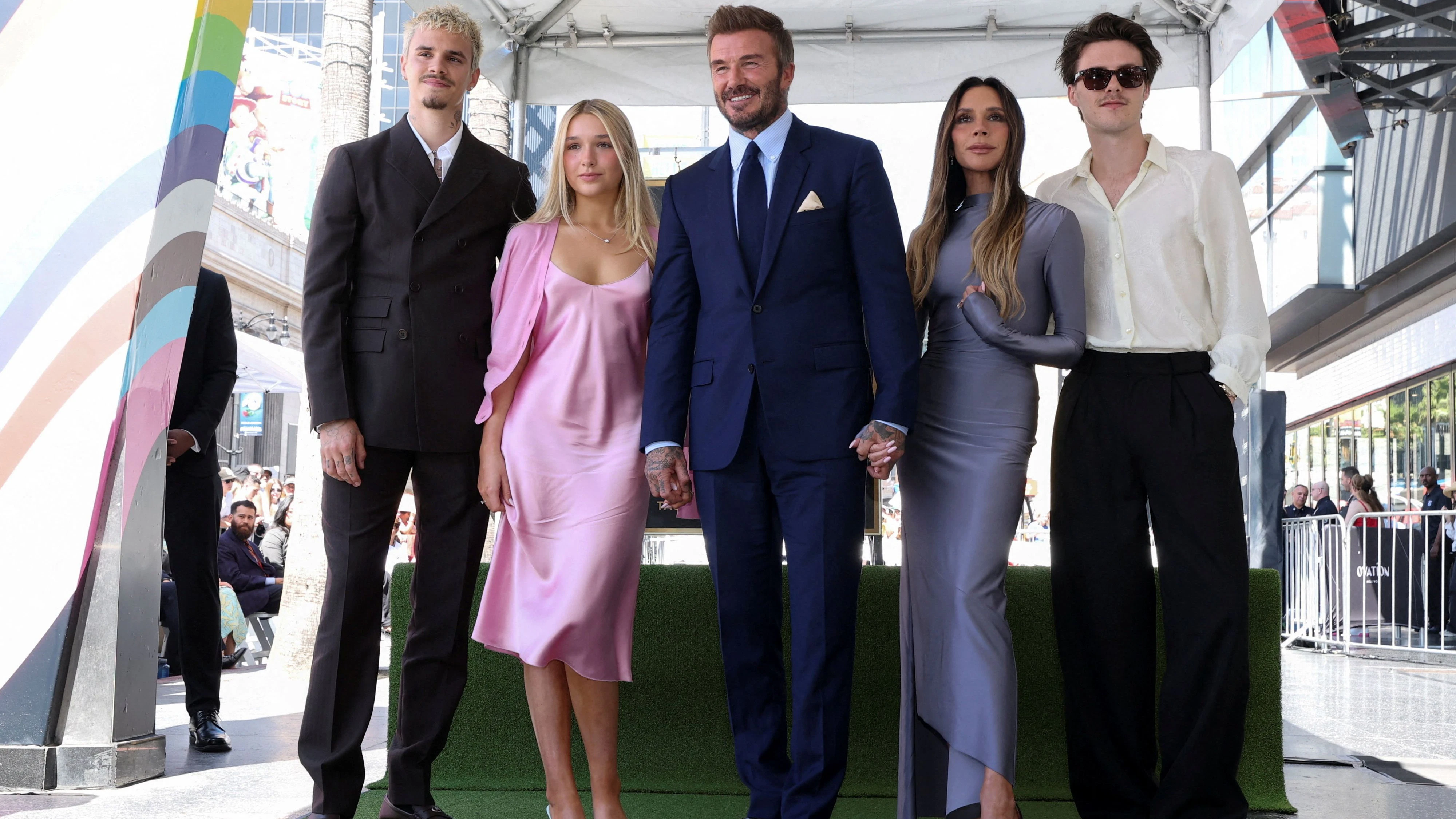 David Beckham poses with his wife Victoria Beckham, his daughter Harper Beckham and his sons Cruz Beckham and Romeo Beckham during his star unveiling ceremony on the Hollywood Walk of Fame, in Los Angeles, California, U.S., June 12, 2026. REUTERS/Mario Anzuoni REMOVING ONE ID -  BROOKLYN BECKHAM