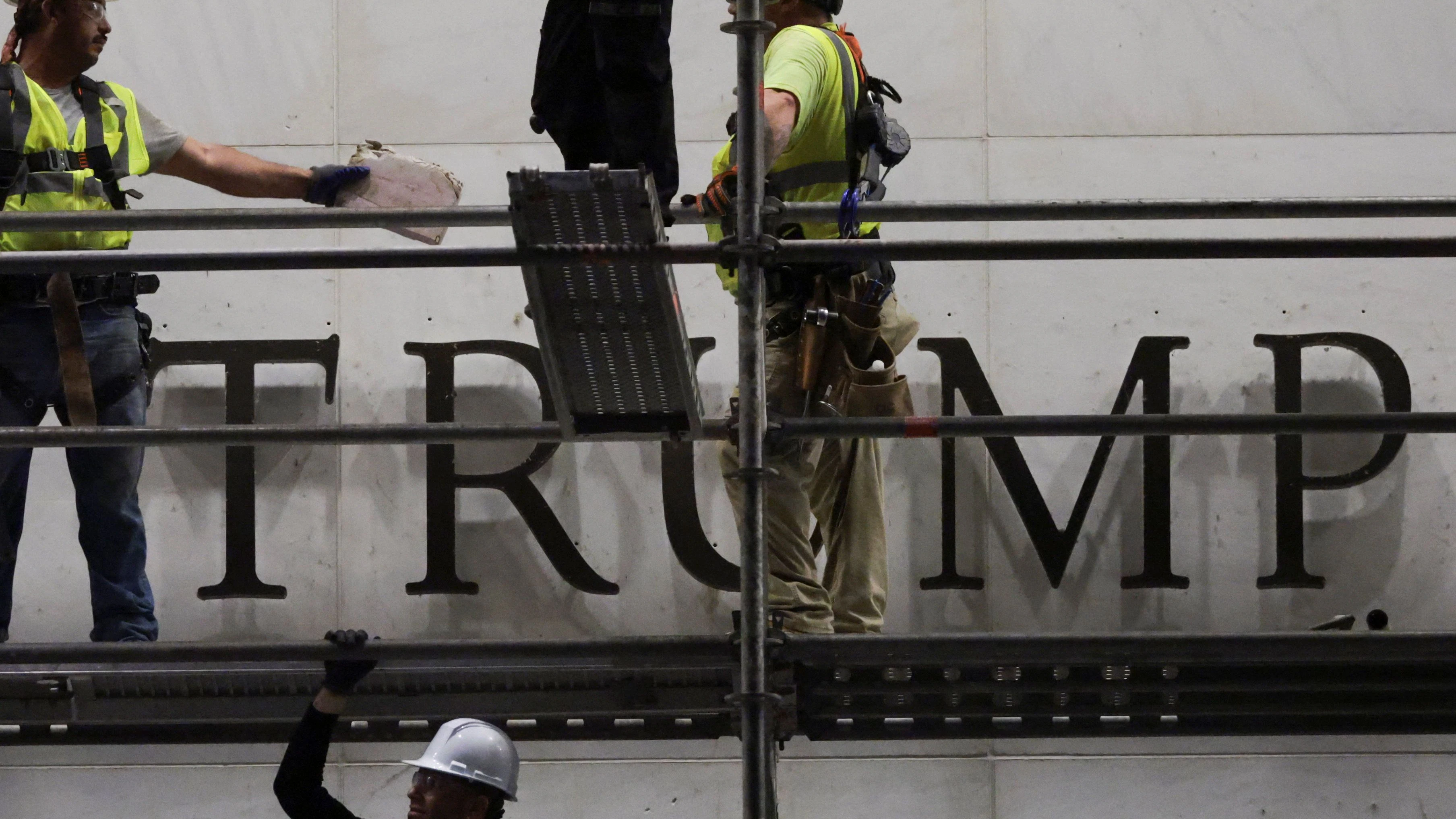 Workers prepare scaffolding ahead of removing lettering from the facade of the John F. Kennedy Memorial Center for the Performing Arts, following a federal judge’s order to remove U.S. President Donald Trump's name from the institution, in Washington, D.C., U.S., June 13, 2026. REUTERS/Jonathan Ernst