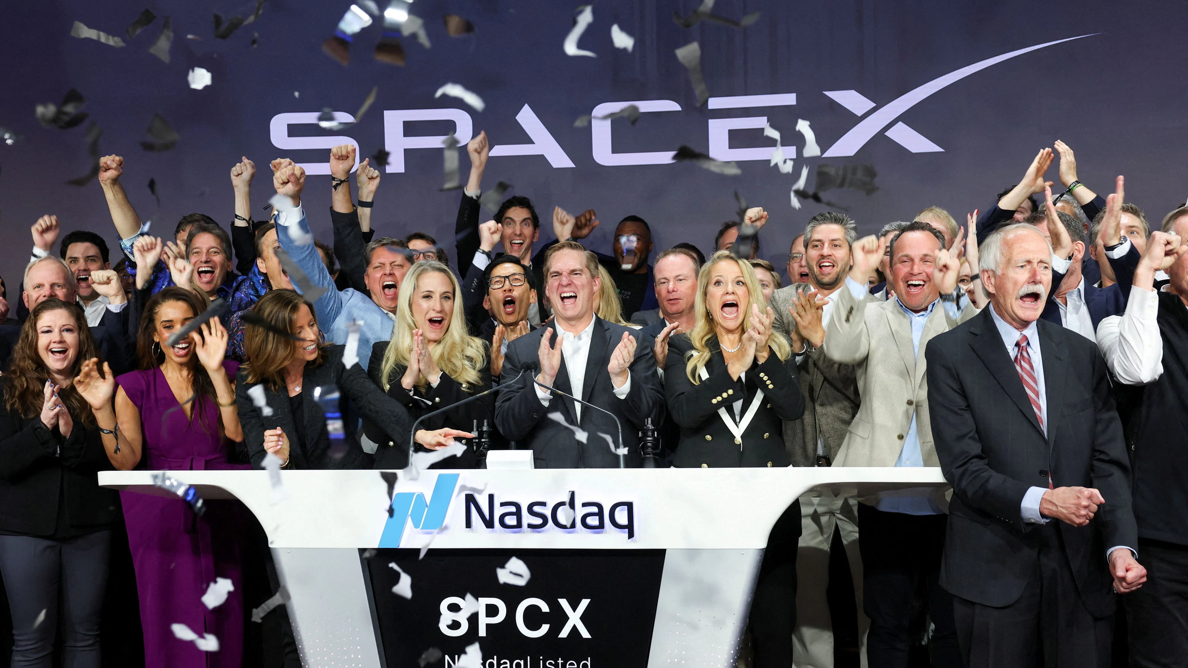 President and COO of SpaceX, Gwynne Shotwell and CFO and President of Strategic Acquisitions, Bret Johnsen are joined by company leadership as they ring the opening bell to celebrate during SpaceX's initial public offering (IPO) at the Nasdaq MarketSite in New York City, U.S., June 12, 2026. REUTERS/Brendan McDermid     TPX IMAGES OF THE DAY     