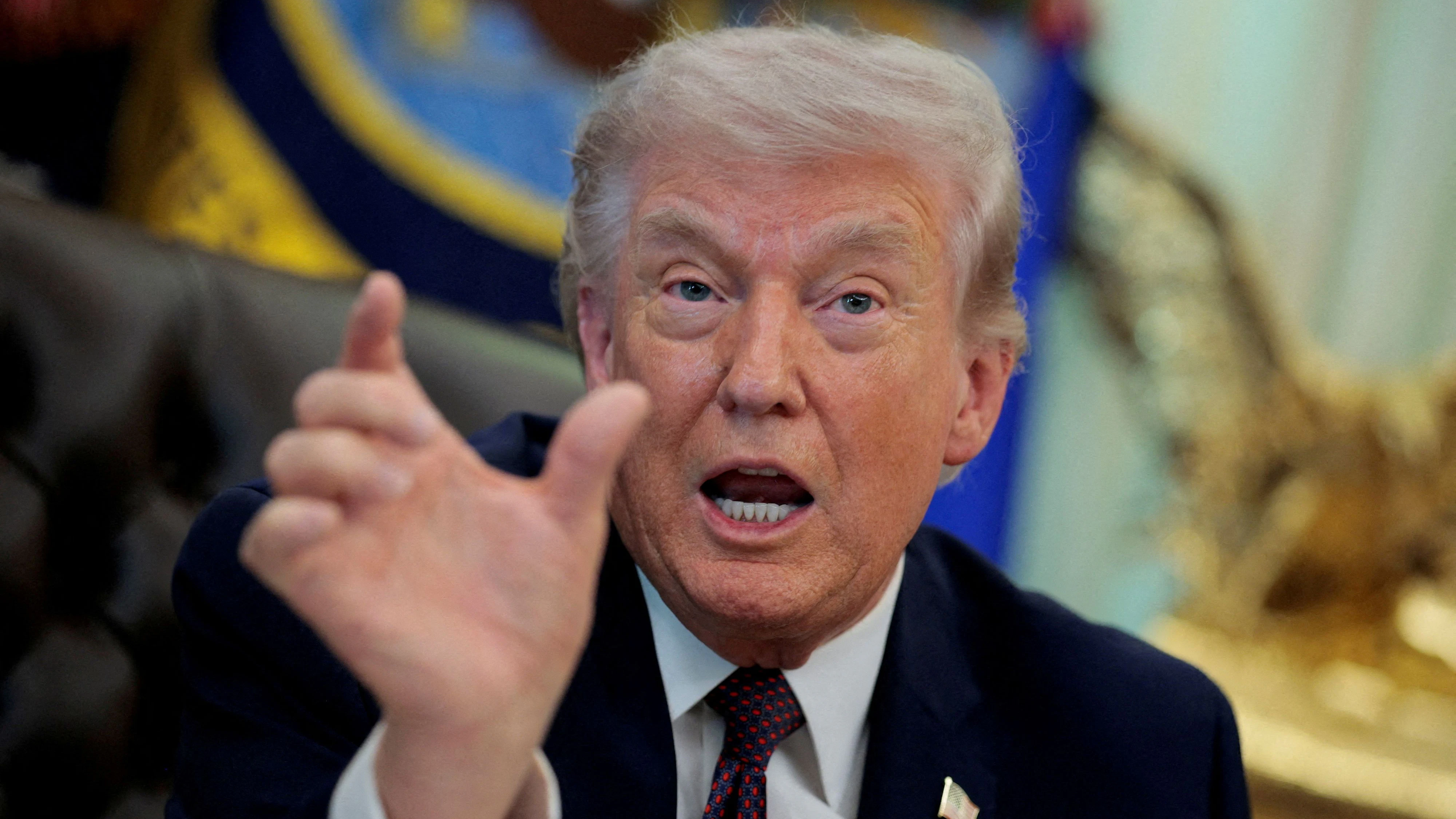 FILE PHOTO: U.S. President Donald Trump speaks during the signing ceremony for an executive order on mail ballots, in the Oval Office of the White House in Washington, D.C., March 31, 2026.  REUTERS/Evan Vucci/File Photo