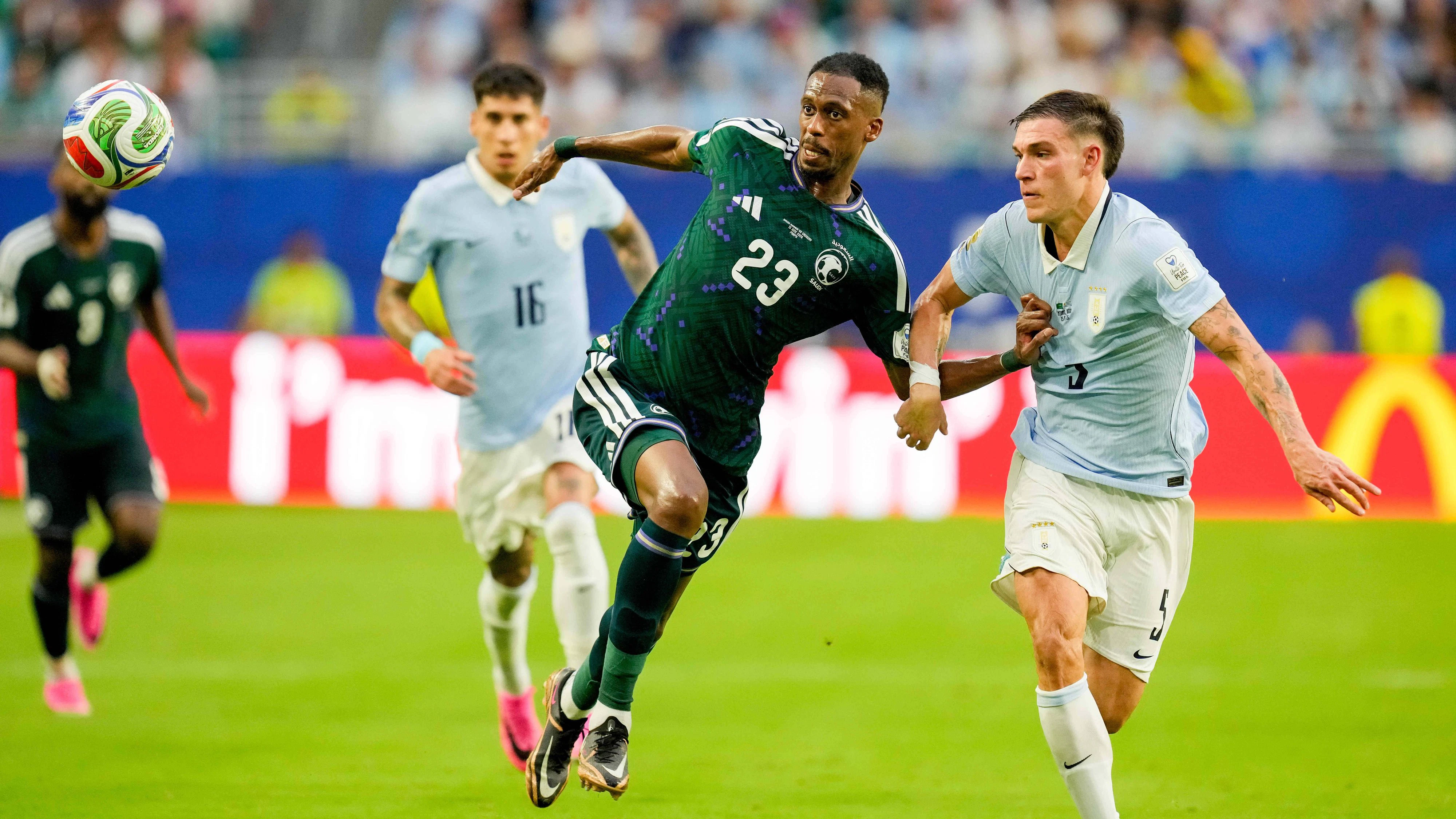 Mohamed Kanno Saudi Arabia und Manuel Ugarte Uruguay battle for the ball during the FIFA World Cup, WM, Weltmeisterschaft, Fussball 2026 Group H match between Saudi Arabia and Uruguay at Miami Stadium on June 15, 2026 in Miami, United States. Photo by Alex Gottschalk/DeFodi Images - *** Mohamed Kanno of Saudi Arabia and Manuel Ugarte of Uruguay battle for the ball during the 2026 FIFA World Cup Group H match between Saudi Arabia and Uruguay at Miami Stadium on June 15, 2026, in Miami, United States. Photo by Alex Gottschalk, DeFodi Images,detected_source_language