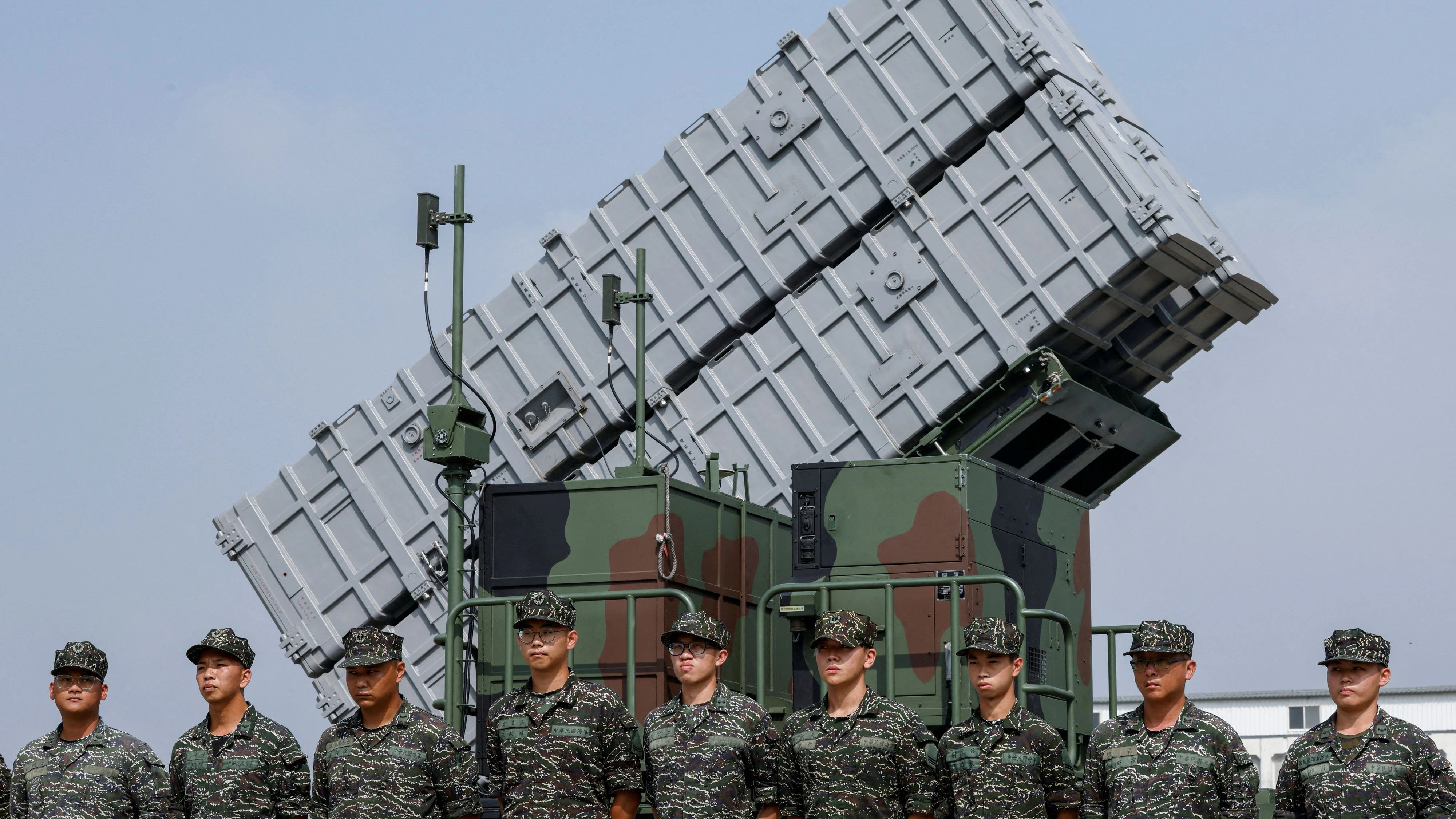 FILE PHOTO: Members of the Taiwanese Navy Hai Feng (Sea Blade) Group stand in front of Hsiung Feng III mobile missile launcher during Taiwanese President Lai Ching-te’s visit to the base in response to recent Chinese military drills, in Taoyuan, Taiwan October 18, 2024. REUTERS/Tyrone Siu/File Photo