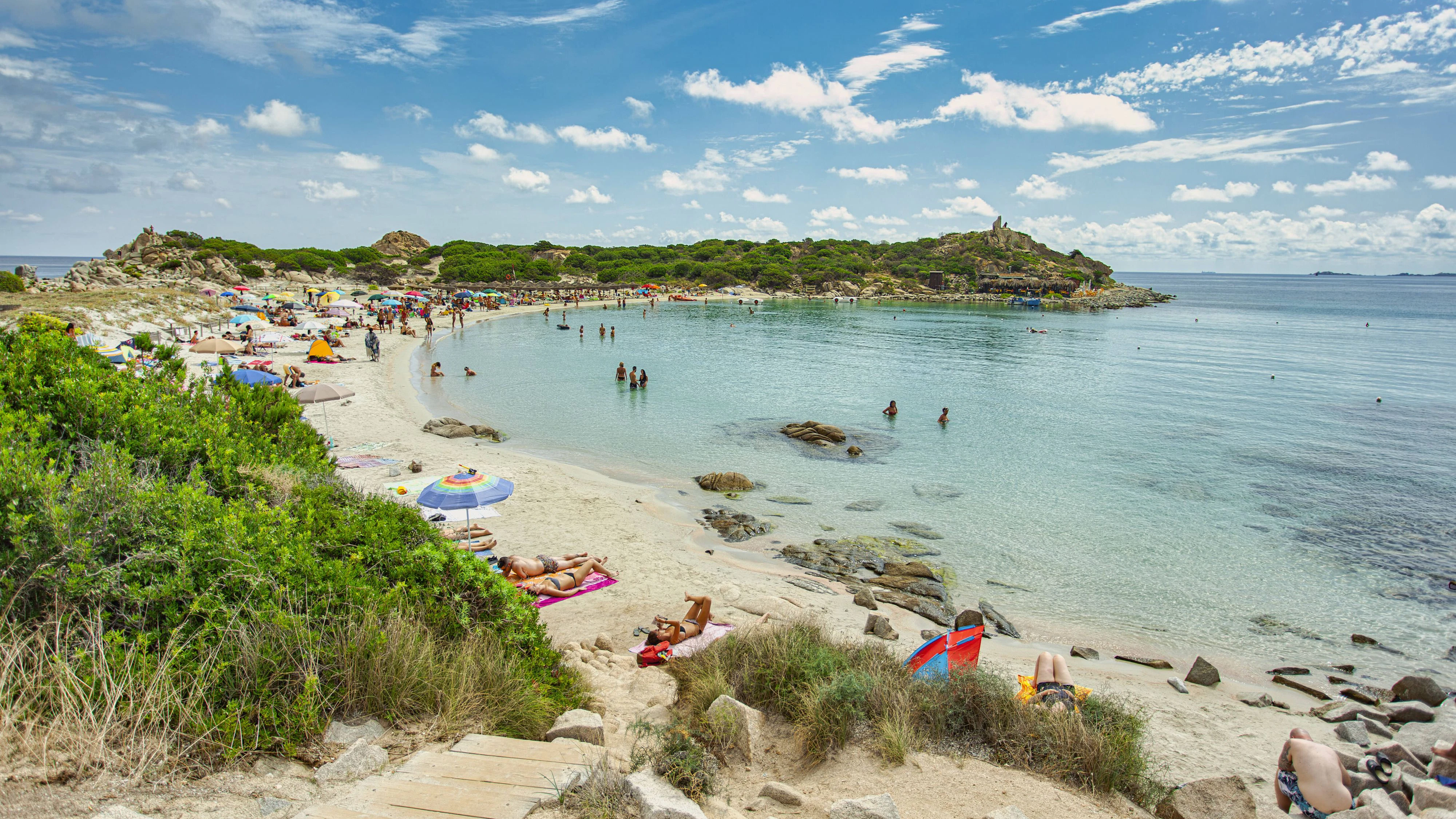 Tourists enjoying summer vacations sunbathing and swimming in the turquoise clear water of punta molentis beach, villasimius, sardinia, italy Tourists relaxing on punta molentis beach in villasimius, sardinia, italy Copyright: xx REMASTERED C 39