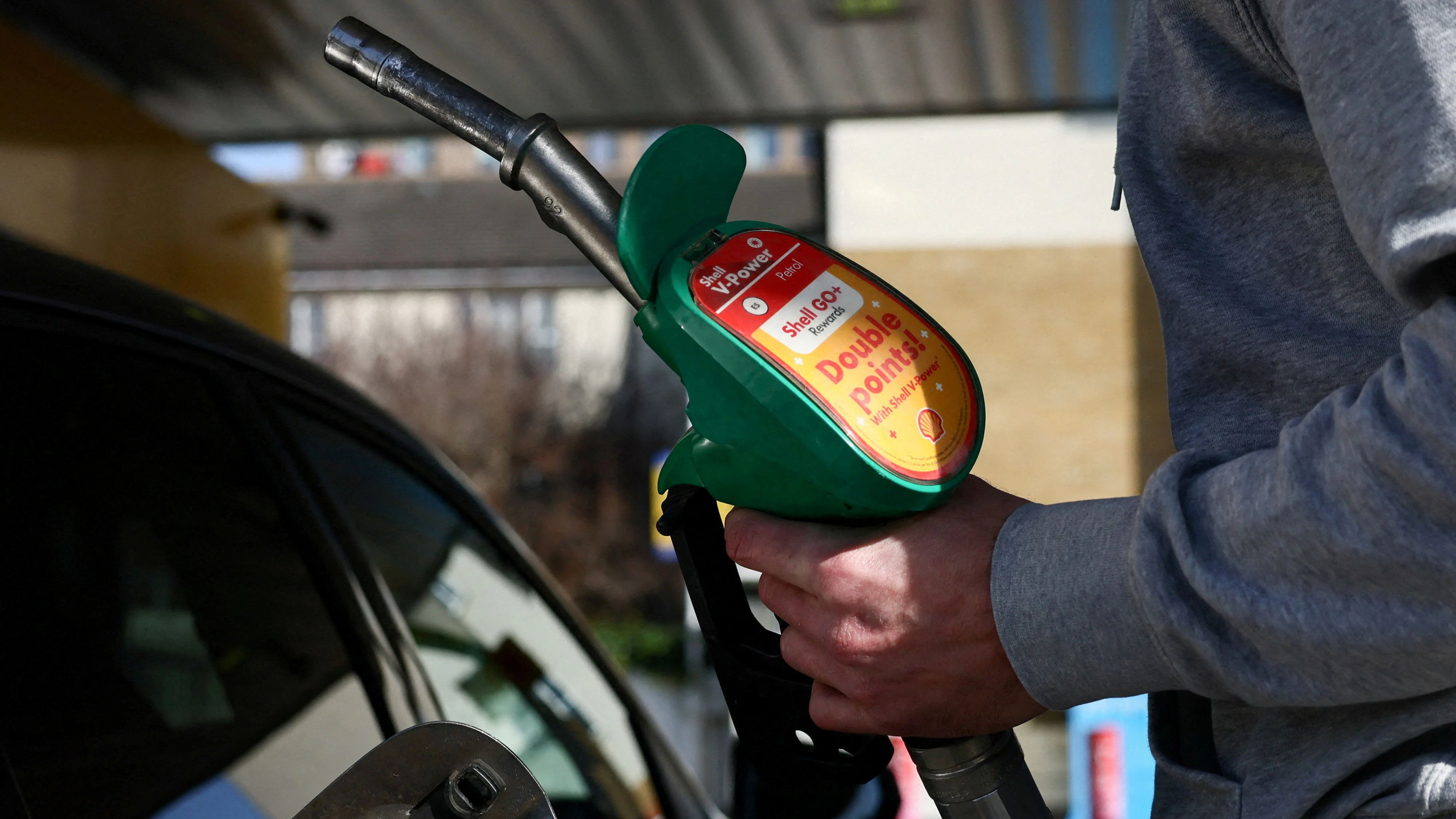 FILE PHOTO: A motorist returns the petrol pump after filling their car with fuel at a petrol station, as the price of oil and gas has surged amid the conflict in the Middle East, in London, Britain, March 5, 2026 REUTERS/Jack Taylor/File Photo