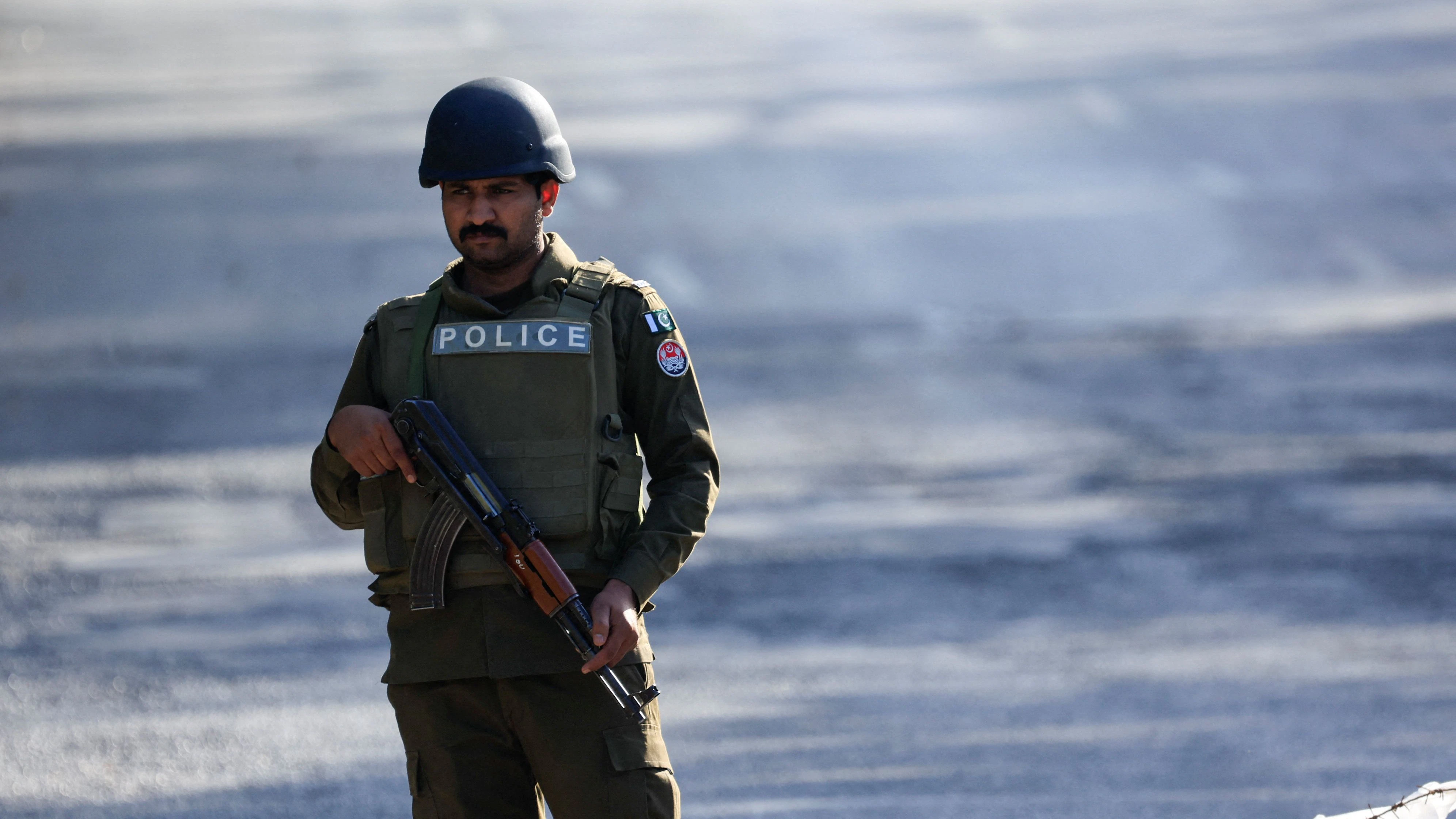 A Police officer stands guard on a road leading to Serena hotel, the venue for the second phase of peace talks between the United States and Iran hosted by Pakistan, in Islamabad, Pakistan, April 20, 2026. REUTERS/Akhtar Soomro