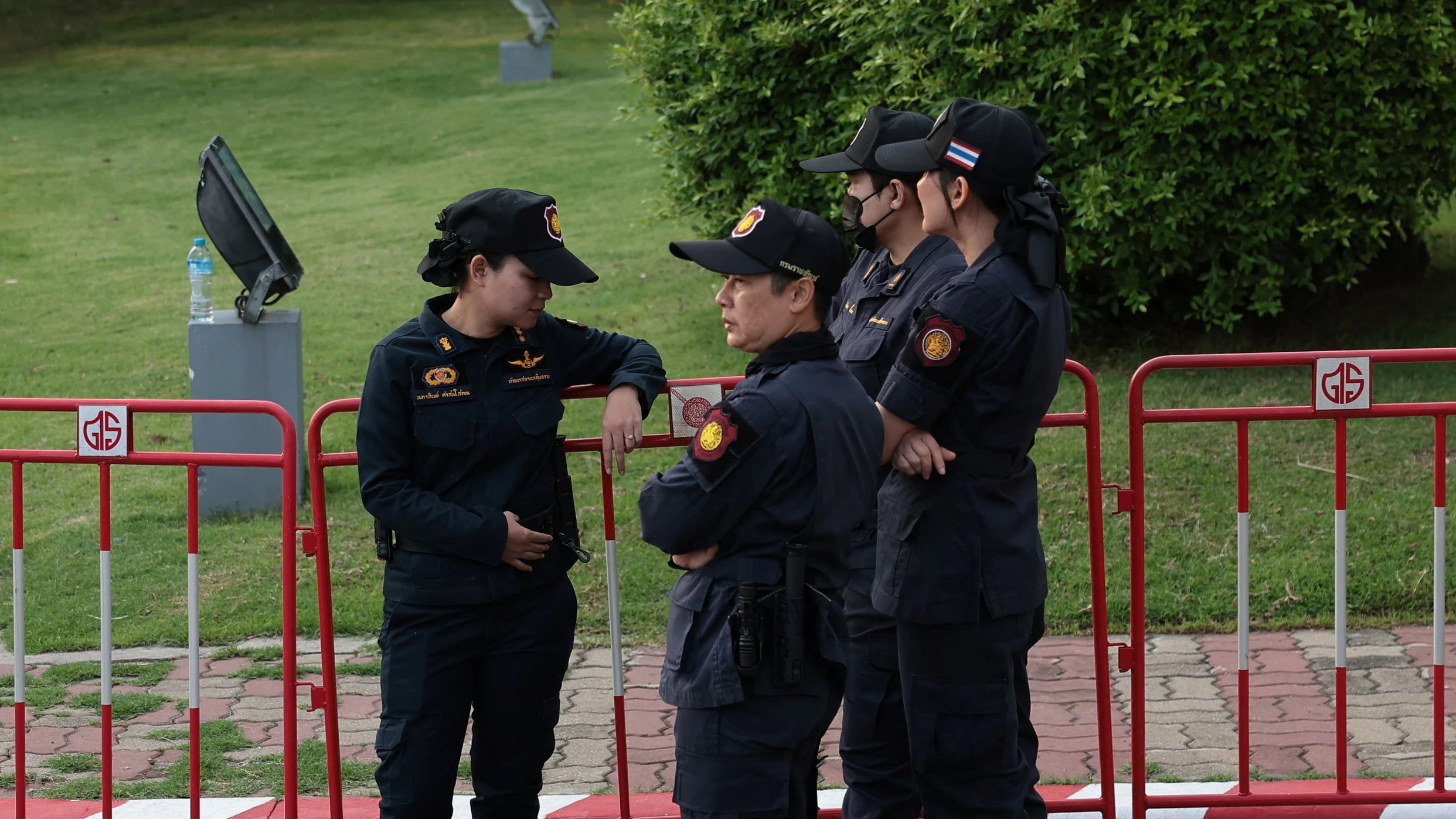 Police officers stand guard outside Klong Prem Central Prison as supporters of former Thai Prime Minister Thaksin Shinawatra wait for his release on parole after serving eight months of his one-year sentence, in Bangkok, Thailand, May 11, 2026. REUTERS/Chalinee Thirasupa