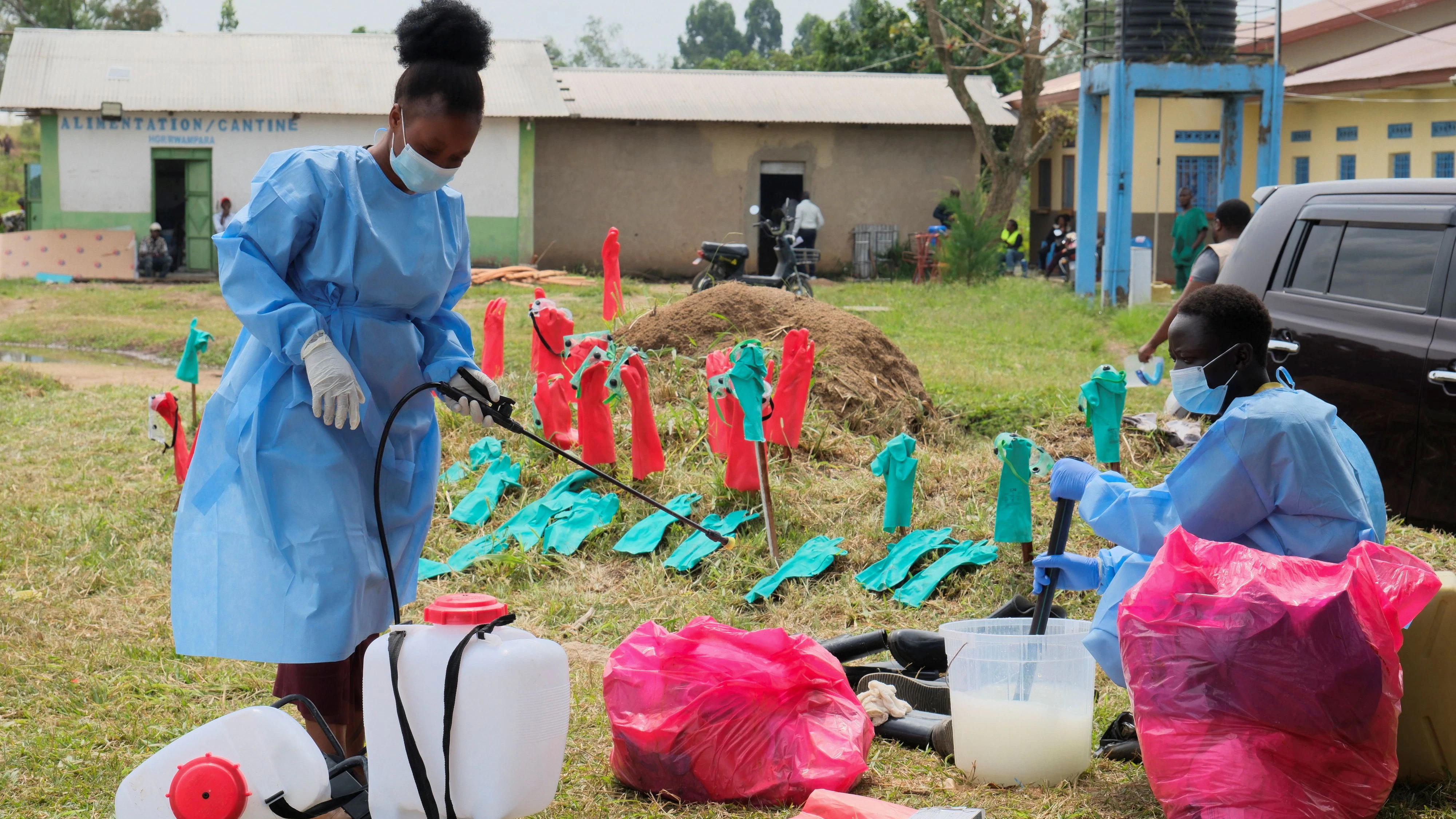 Medical workers dressed in personal protective equipment (PPE) disinfect their equipment at an Ebola treatment centre during a ceremony to present recovery certificates to patients at the Rwambara General Reference Hospital in Bunia, eastern Democratic Republic of Congo, June 16, 2026. REUTERS/Gradel Muyisa Mumbere