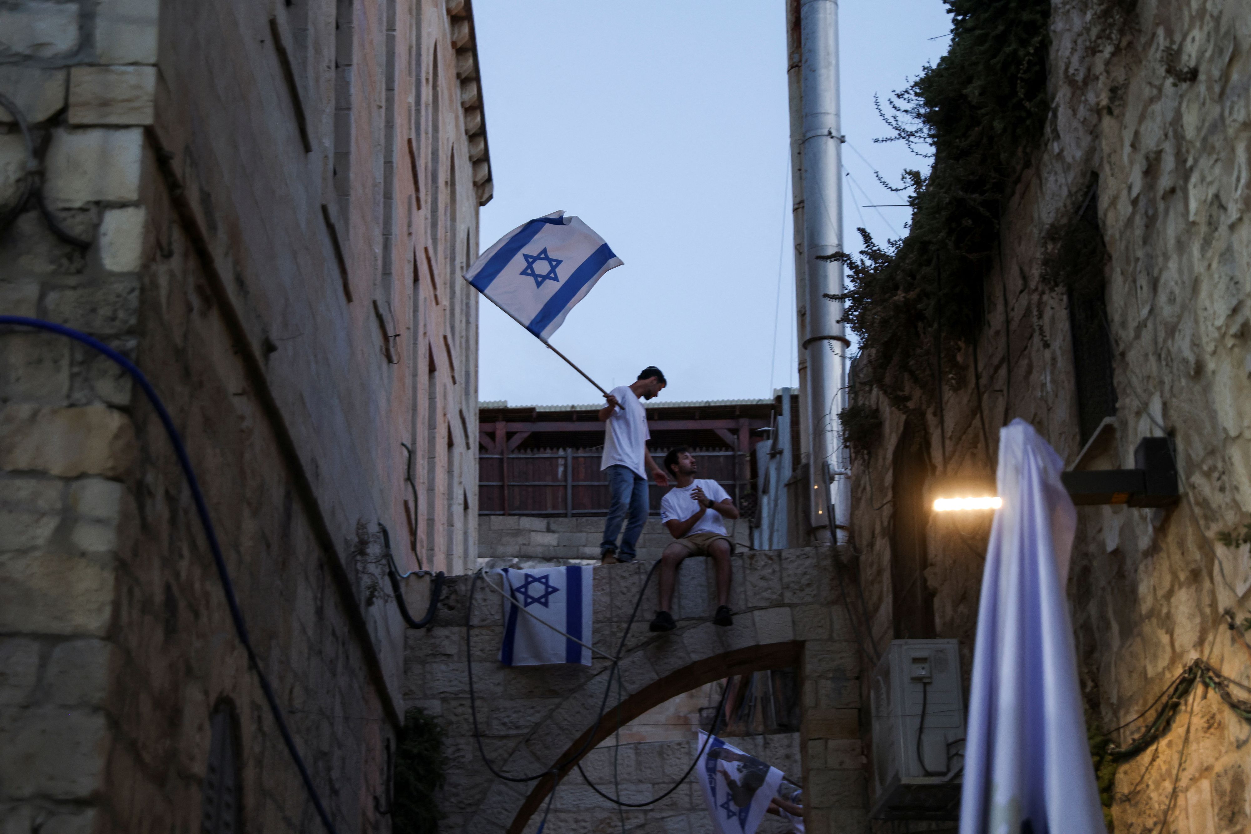 A person holds an Israeli flag, during the Jerusalem Day, in Jerusalem, May 26, 2025. REUTERS/Shir Torem