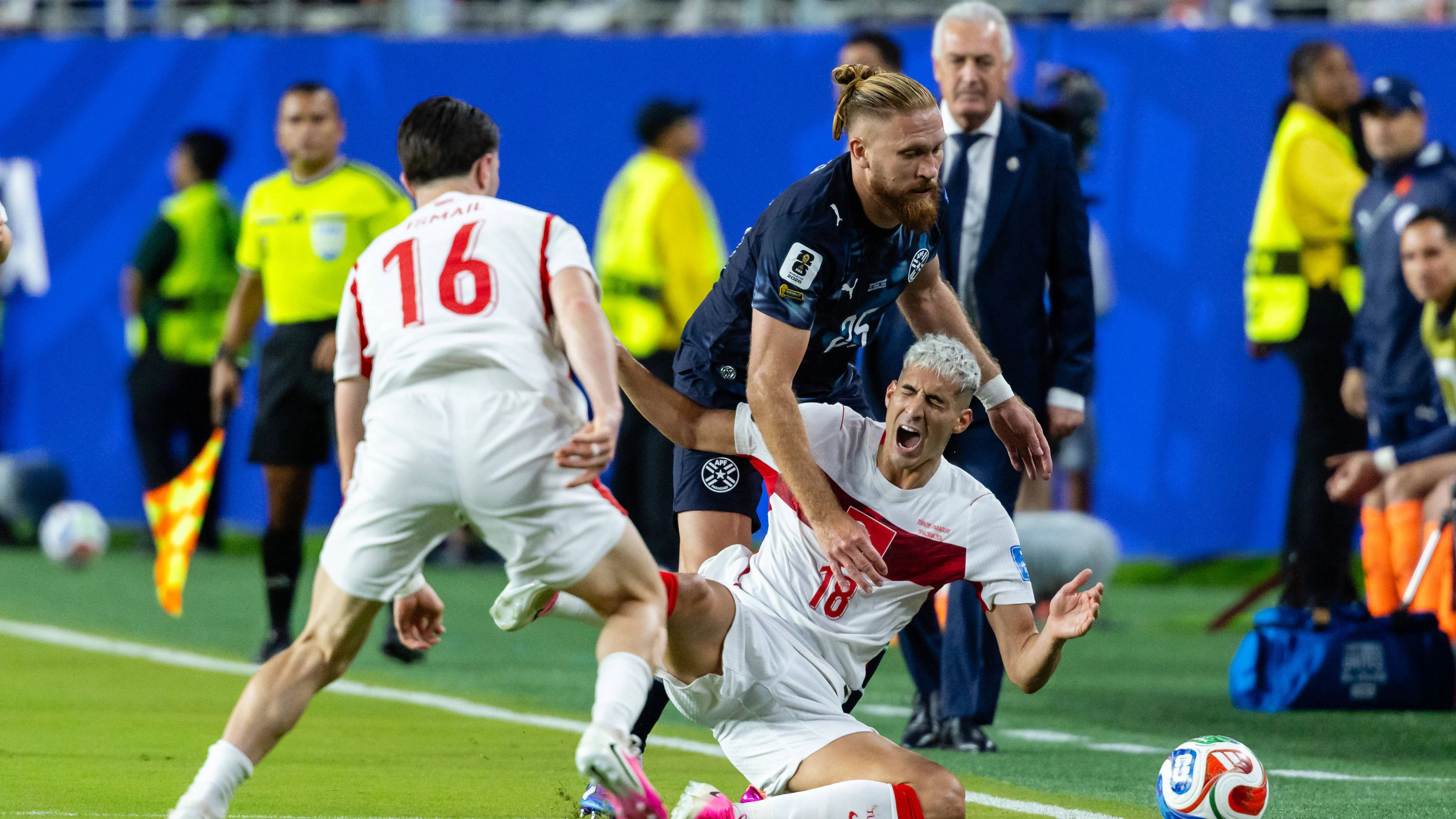 SANTA CLARA, CA - JUNE 19: Mert Muldur 18 of Turkiye falls to the ground after contact with Isidro Pitta 25 of Paraguay during the FIFA World Cup, WM, Weltmeisterschaft, Fussball 2026 Group D match between Turkiye and Paraguay on June 19, 2026 at San Francisco Bay Area Stadium in Santa Clara, CA. Photo by Matthew Huang/Icon Sportswire SOCCER: JUN 19 FIFA World Cup 26 Group D - Turkiye vs Paraguay EDITORIAL USE ONLY Icon260619009