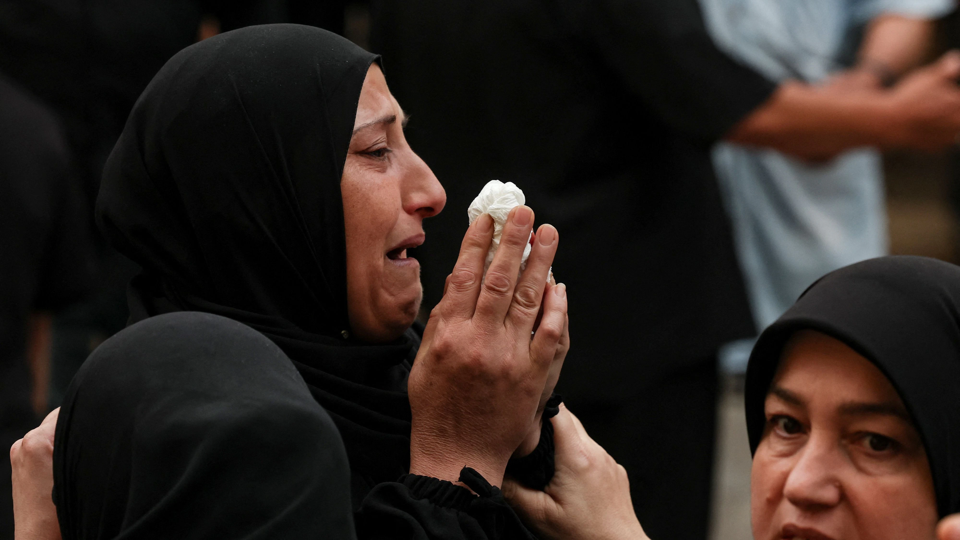 Mourners attend the funeral of four women after an Israeli strike on Saturday on the village of Qennarit, in southern Lebanon,  June 21, 2026. REUTERS/Aziz Taher