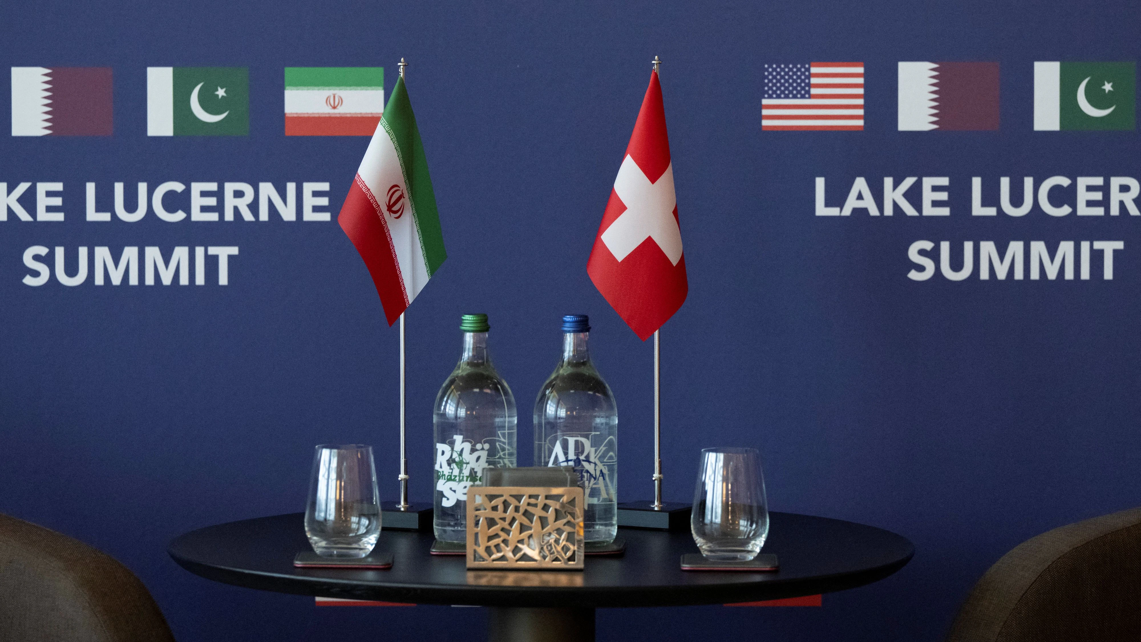 Iranian Flag and Swiss Falg before the Meeting of Minister of Foreign Affairs of Iran Abbas Araqchi and Swiss Federal Councillor Ignazio Cassis at bilateral discussions at the Buergenstock resort in Obbuergen, near Lucerne, Switzerland, Sunday, June 21, 2026.    URS FLUEELER/Pool via REUTERS