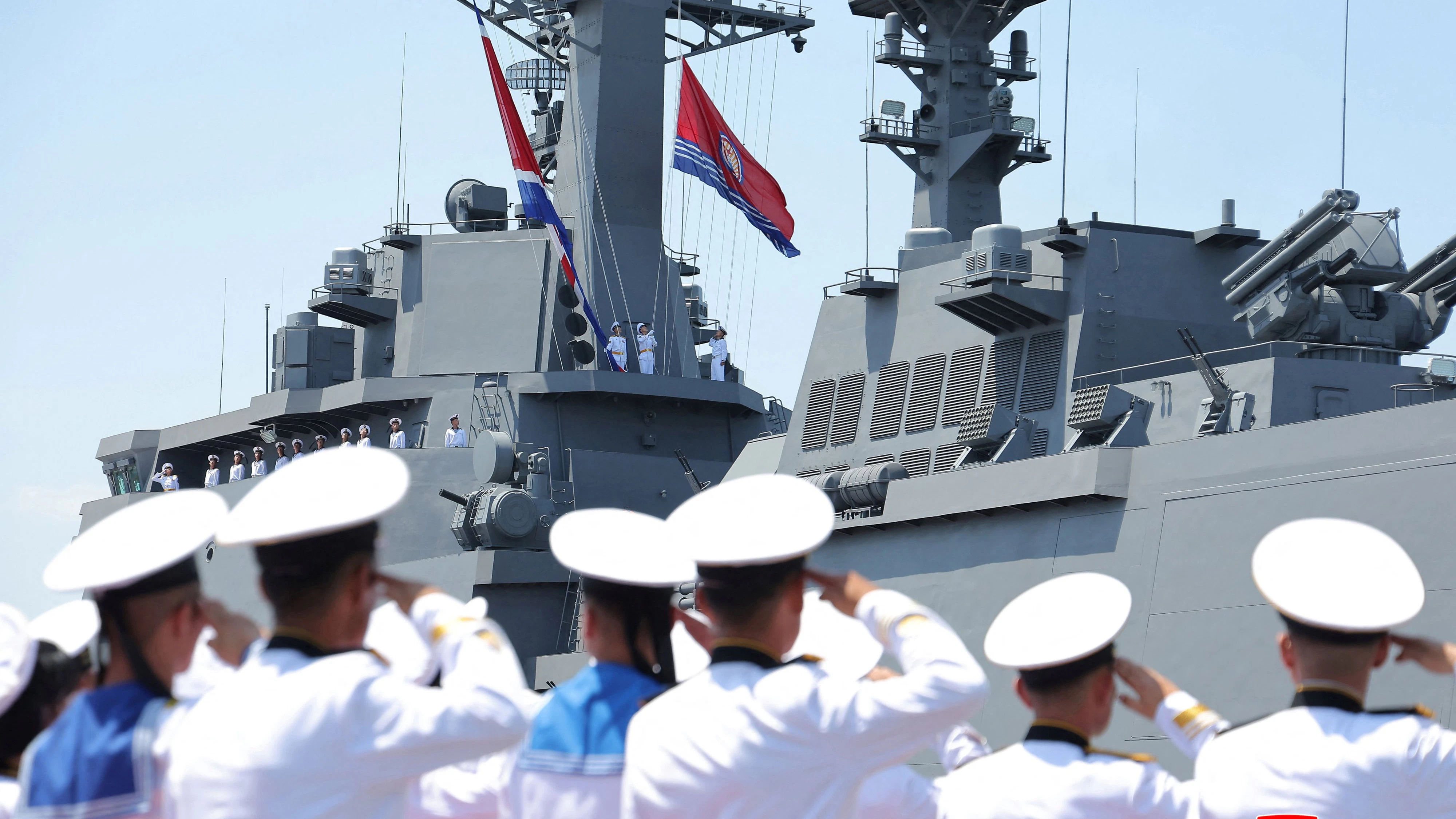 Sailors salute during the commissioning ceremony of the new multipurpose destroyer Choe Hyon at Nampho port, North Korea, June 23, 2026, in this picture released by North Korea's official Korean Central News Agency.   KCNA via REUTERS    ATTENTION EDITORS - THIS IMAGE WAS PROVIDED BY A THIRD PARTY. REUTERS IS UNABLE TO INDEPENDENTLY VERIFY THIS IMAGE. NO THIRD PARTY SALES. SOUTH KOREA OUT. NO COMMERCIAL OR EDITORIAL SALES IN SOUTH KOREA.