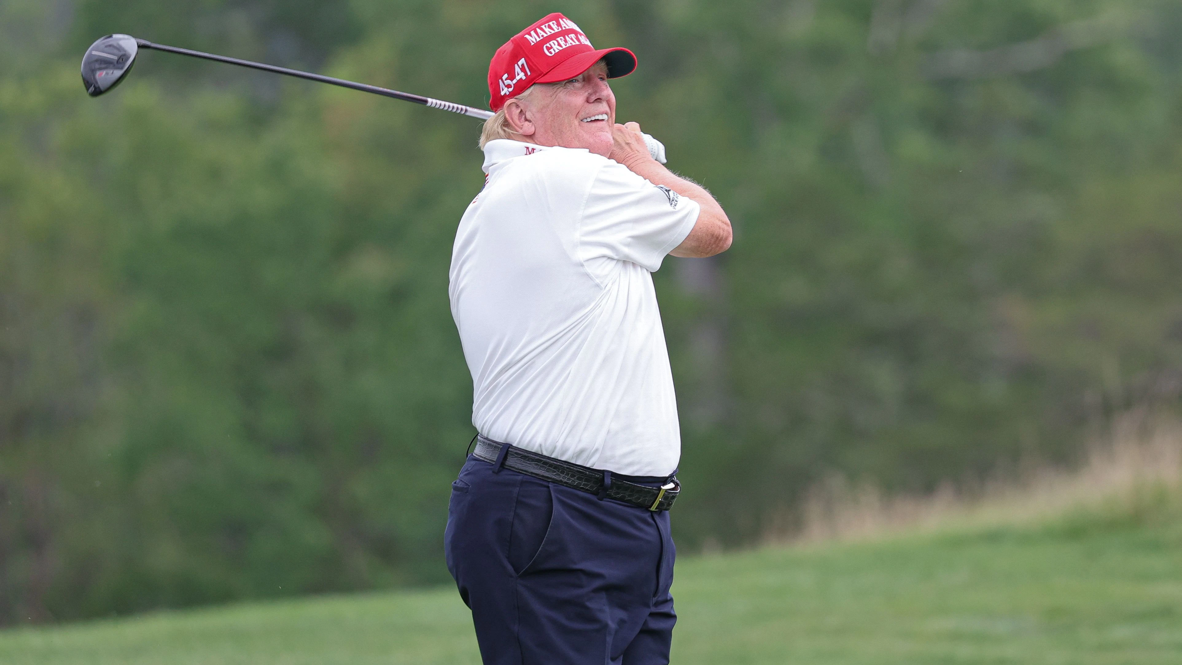 Aug 10, 2023; Bedminster, New Jersey, USA; Former President Donald Trump plays his shot from the ninth tee during the ProAm round of the LIV Golf Bedminster golf tournament at Trump National Bedminster. Mandatory Credit: Vincent Carchietta-USA TODAY Sports