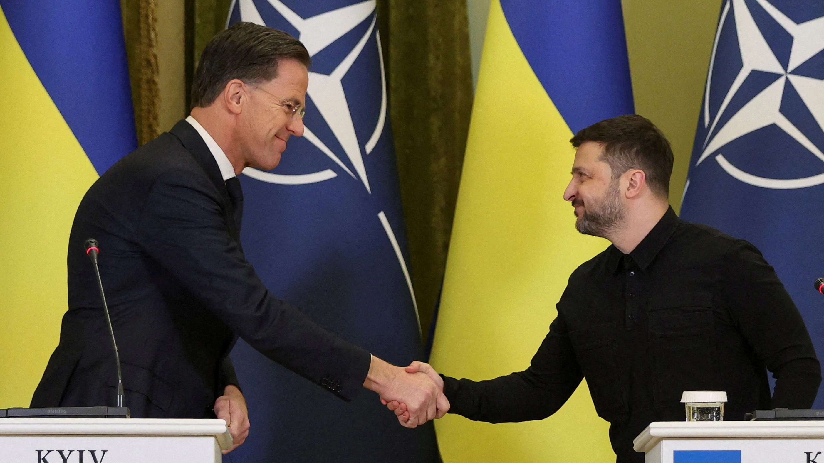 FILE PHOTO: Ukraine's President Volodymyr Zelenskiy and NATO Secretary General Mark Rutte shake hands during a joint press conference, amid Russia's attack on Ukraine, in Kyiv, Ukraine February 3, 2026. REUTERS/Anatolii Stepanov     TPX IMAGES OF THE DAY/File Photo