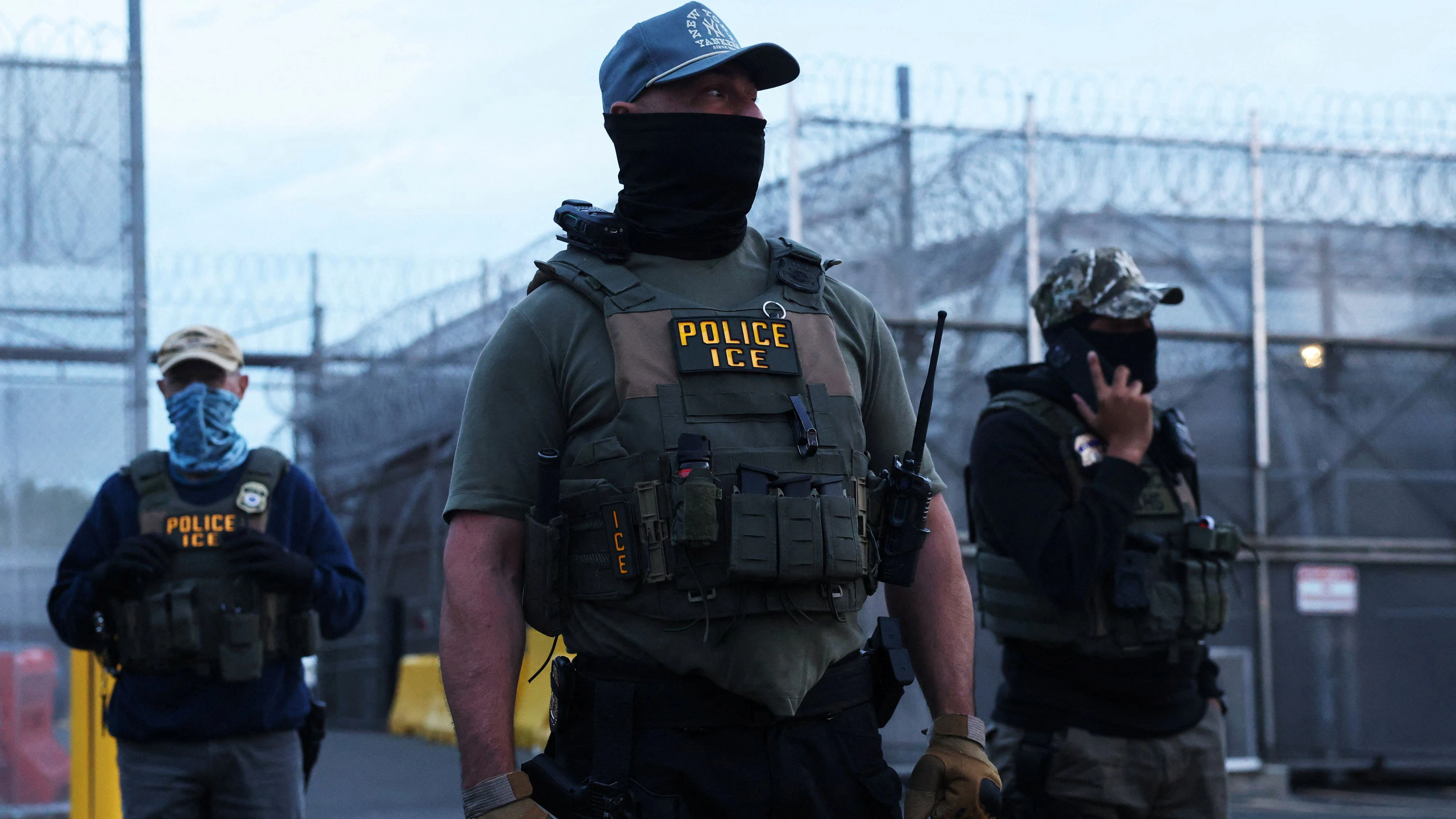 U.S. Immigration and Customs Enforcement (ICE) agents stand outside one entrance of Delaney Hall in Newark, New Jersey, U.S., May 27, 2026. REUTERS/Shannon Stapleton