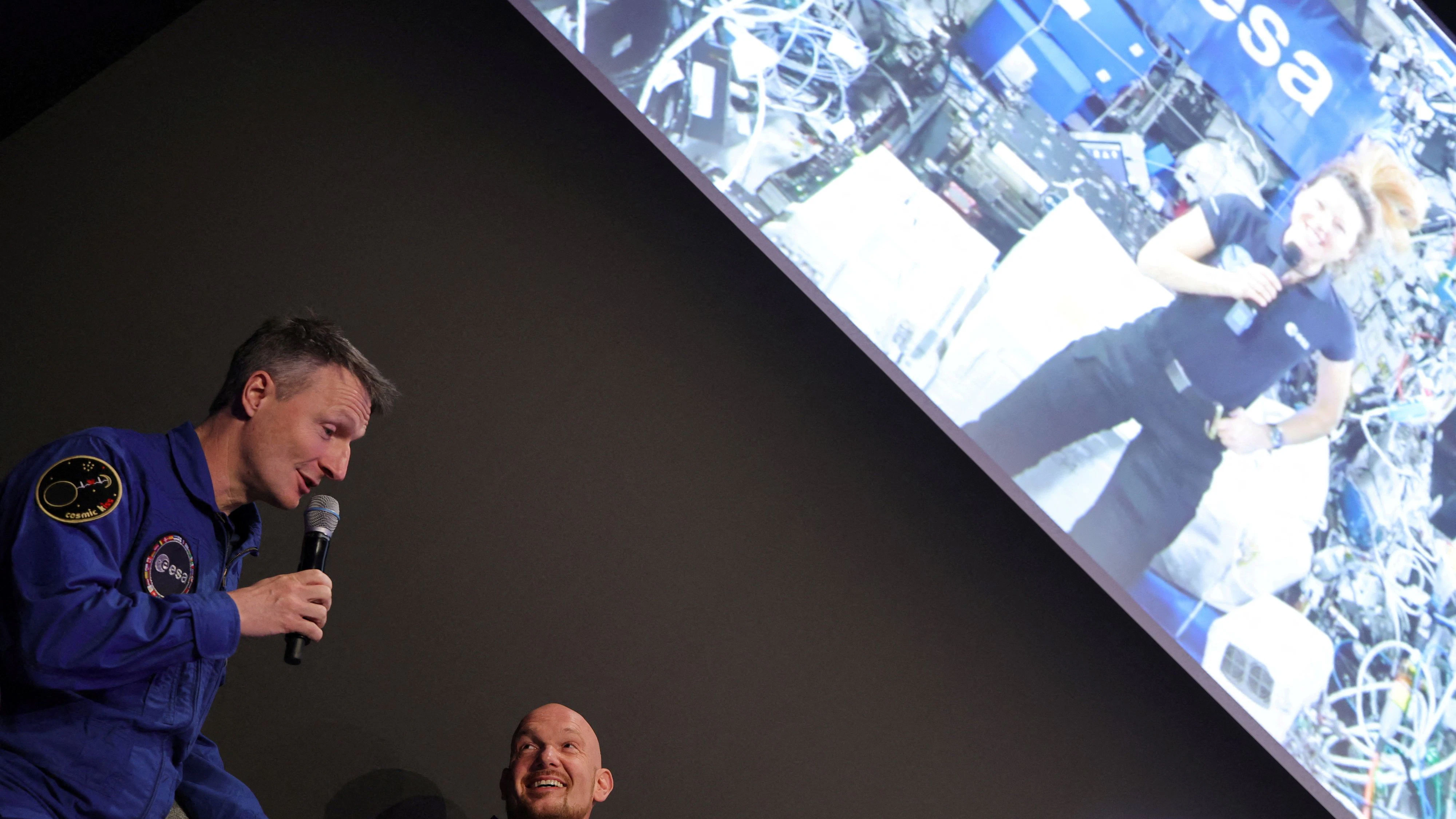 European Space Agency (ESA) German astronauts Matthias Maurer and Alexander Gerst talk during a live video link-up to the ISS International Space Station connecting for a panel discussion with ESA astronaut Sophie Adenot, at the International Aerospace Exhibition ILA at Schoenefeld Airport in Berlin, Germany, June 11, 2026. REUTERS/Fabrizio Bensch     TPX IMAGES OF THE DAY     