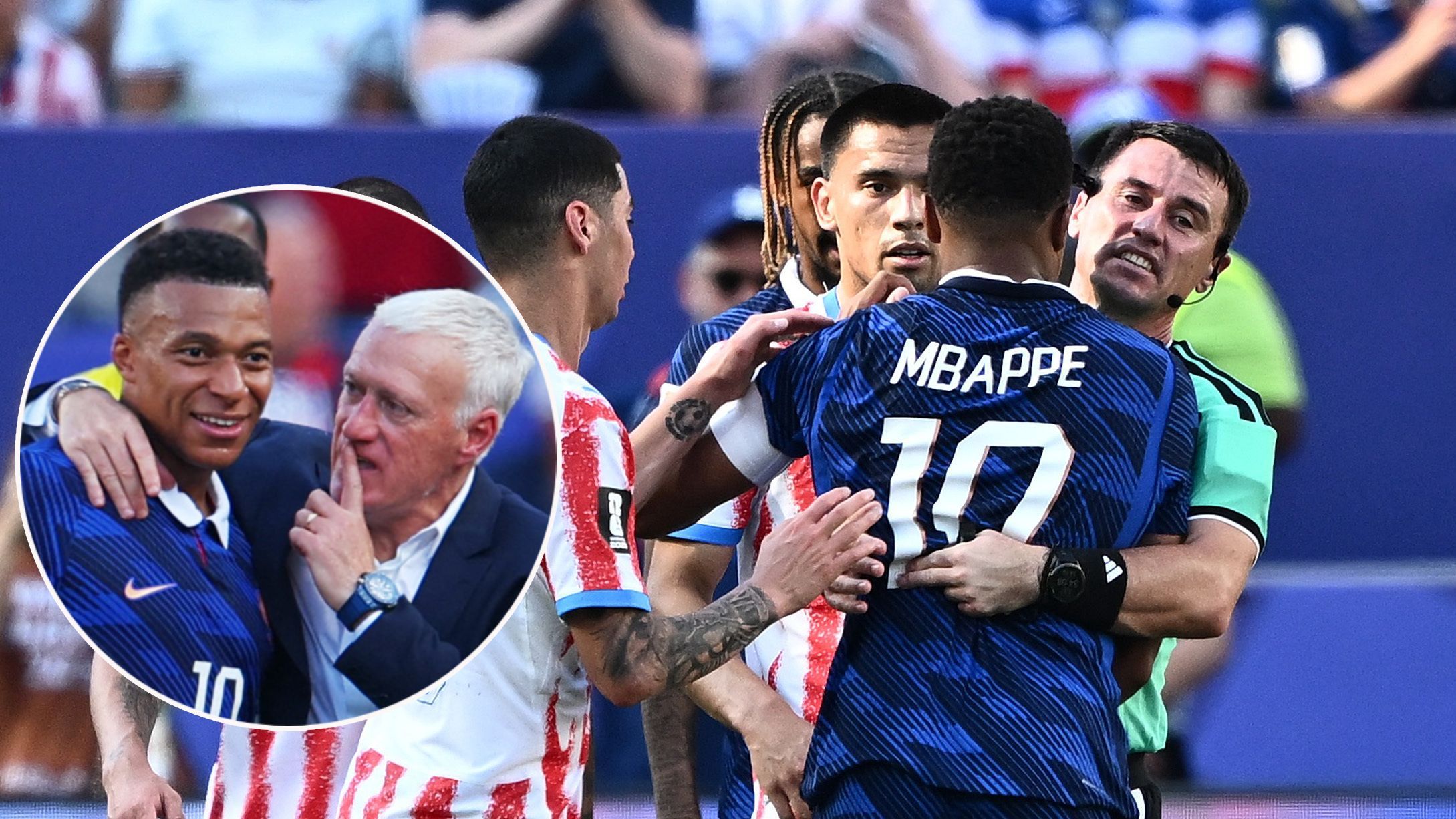 Kylian Mbappe muss von Teamchef Didier Deschamps und von Referee Ilgiz Tantashev zurückgehalten werden