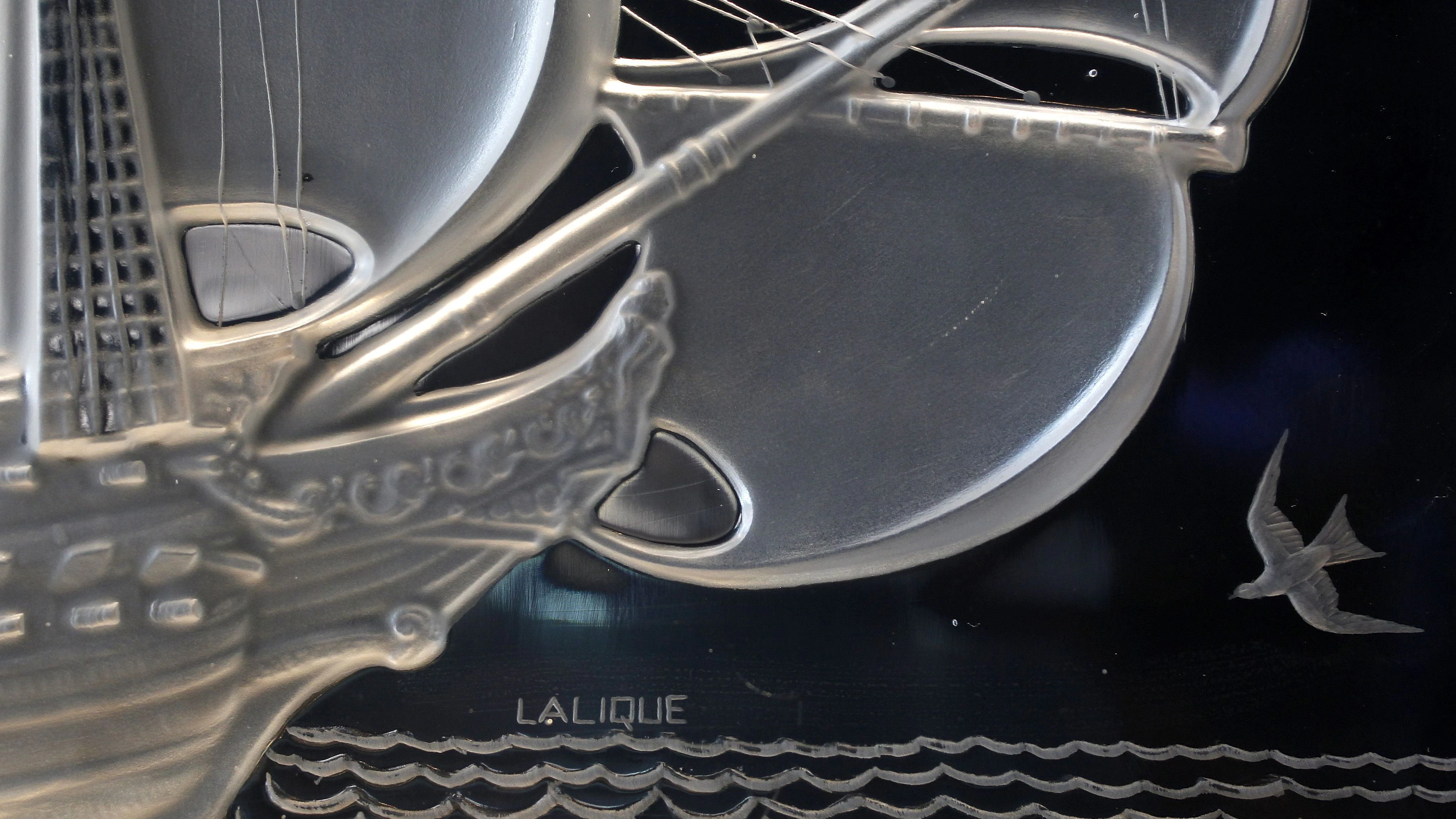 Detail of a crystal creation (1938) bearing the signature of late French artist, designer and glass maker Rene Lalique taken at the Lalique Museum in Wingen sur Moder, Eastern France, June 15, 2011. The Lalique museum, dedicated to designer Rene Lalique (1860-1945), will open to the public on July 2nd in Wingen sur Moder, the Alsatian village where he decided to build his factory after World War I which remains the unique site of production for Lalique branded crystal ware.  REUTERS/Vincent Kessler (FRANCE - Tags: SOCIETY BUSINESS)