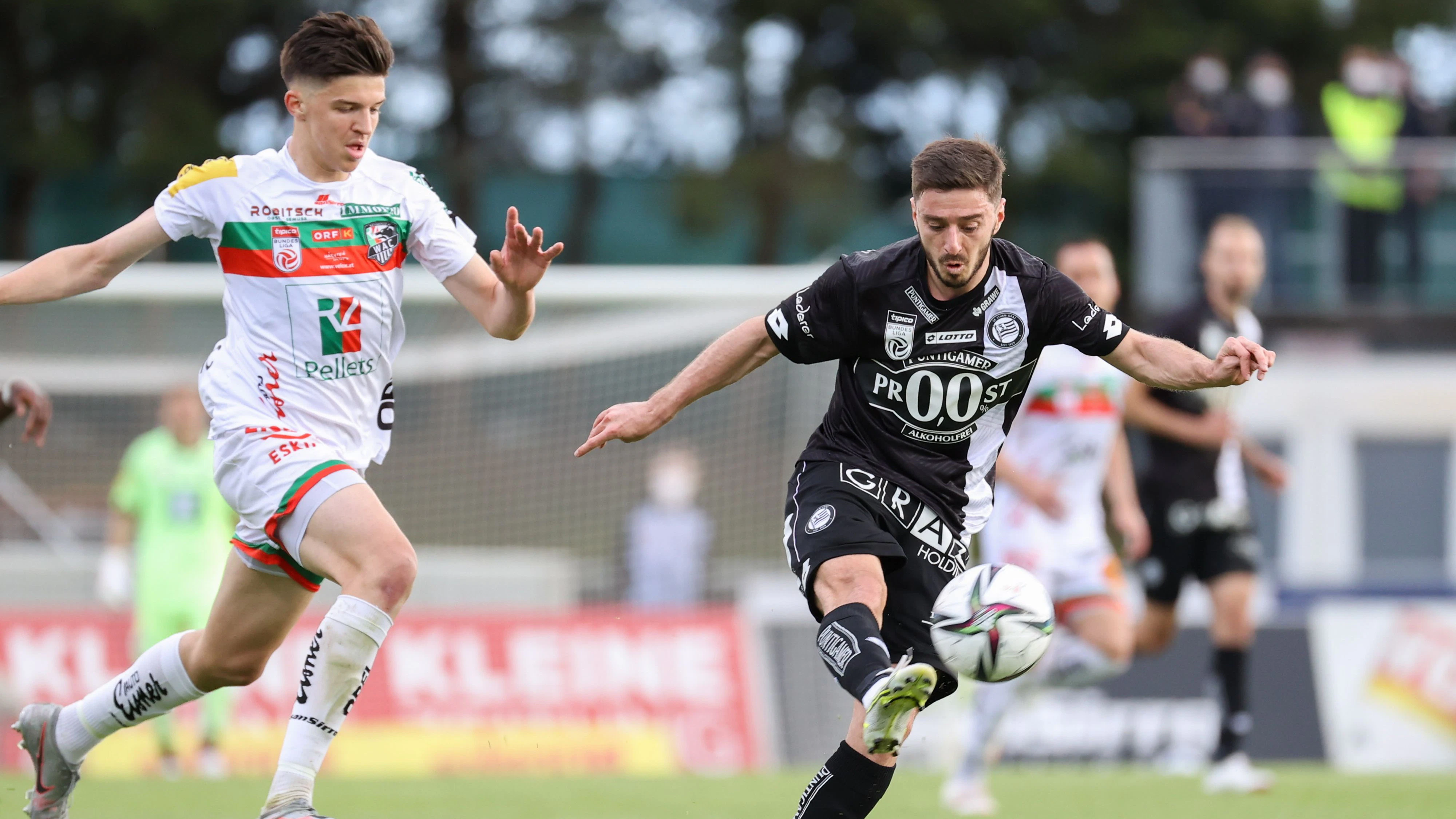 WOLFSBERG,AUSTRIA,22.MAY.21 - SOCCER - tipico Bundesliga, championship group, Wolfsberger AC vs SK Sturm Graz. Image shows Tarik Muharemovic (WAC) and Otar Kiteishvili (Sturm). Photo: GEPA pictures/ Christian Walgram