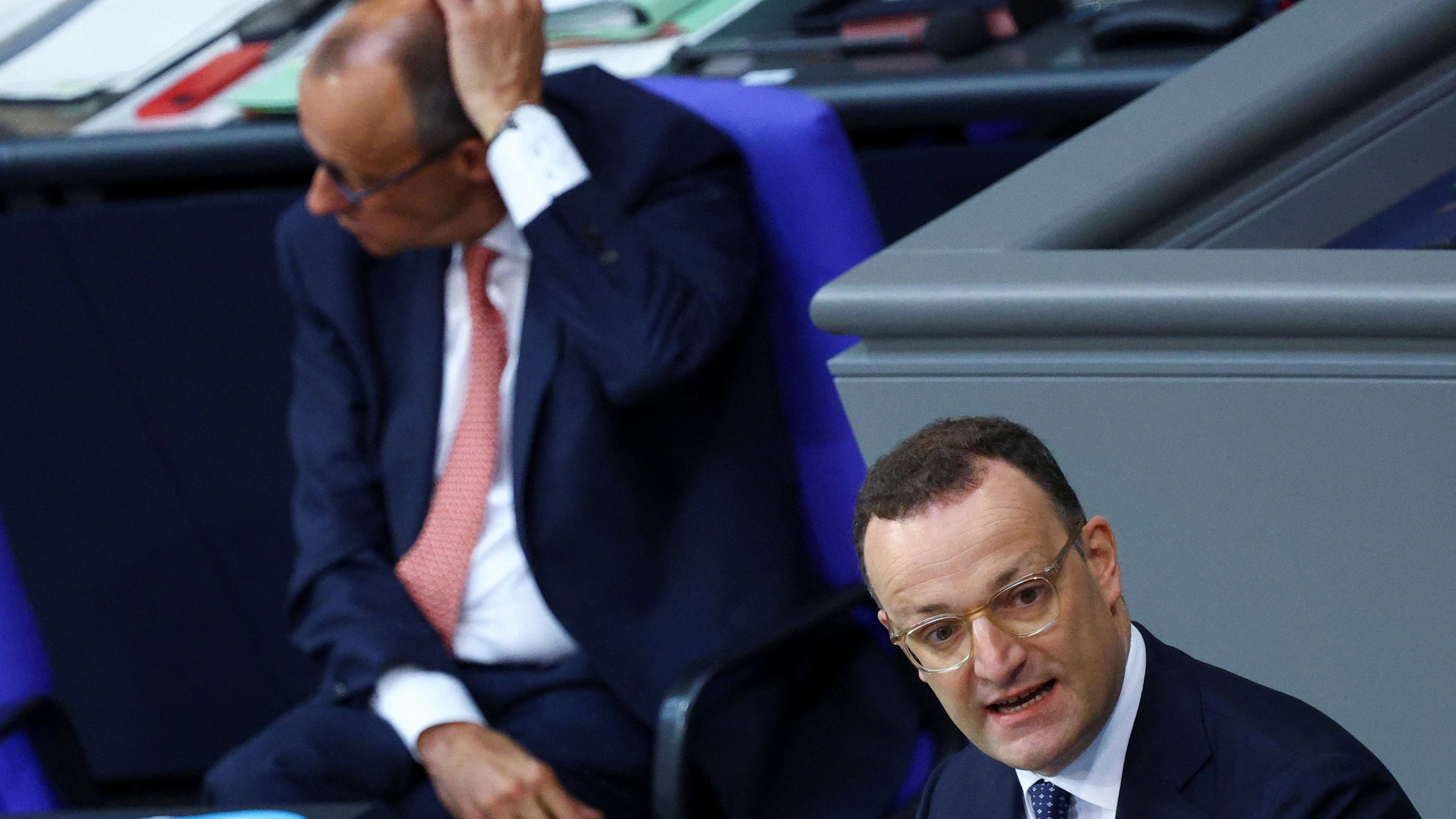 Leader of the CDU/CSU parliamentary group Jens Spahn speaks as German Chancellor Friedrich Merz sits in the German lower house of parliament Bundestag during the 2025 to 2029 budget session in Berlin, Germany, July 9, 2025. REUTERS/Lisi Niesner