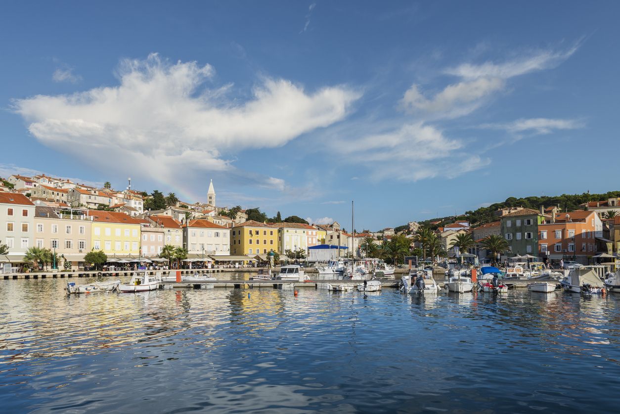Sailing boats and yachts moored in the harbor of Mali Lošinj in the warm evening light, island Lošinj, Kvarner bay, Croatia