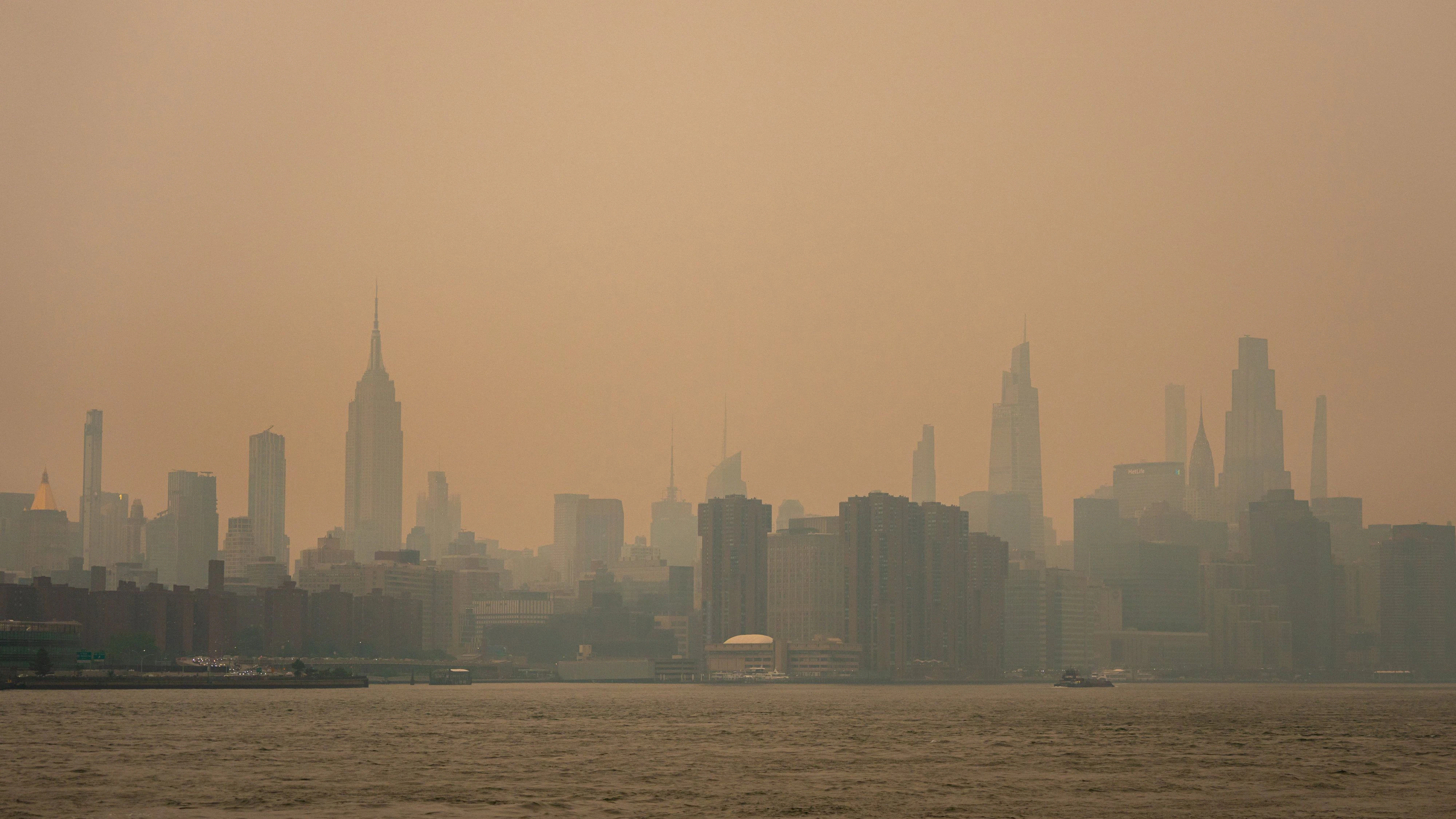 A cover of wildfire smoke clouds the New York City skyline in New York City, U.S., July 15, 2026. REUTERS/Angelina Katsanis