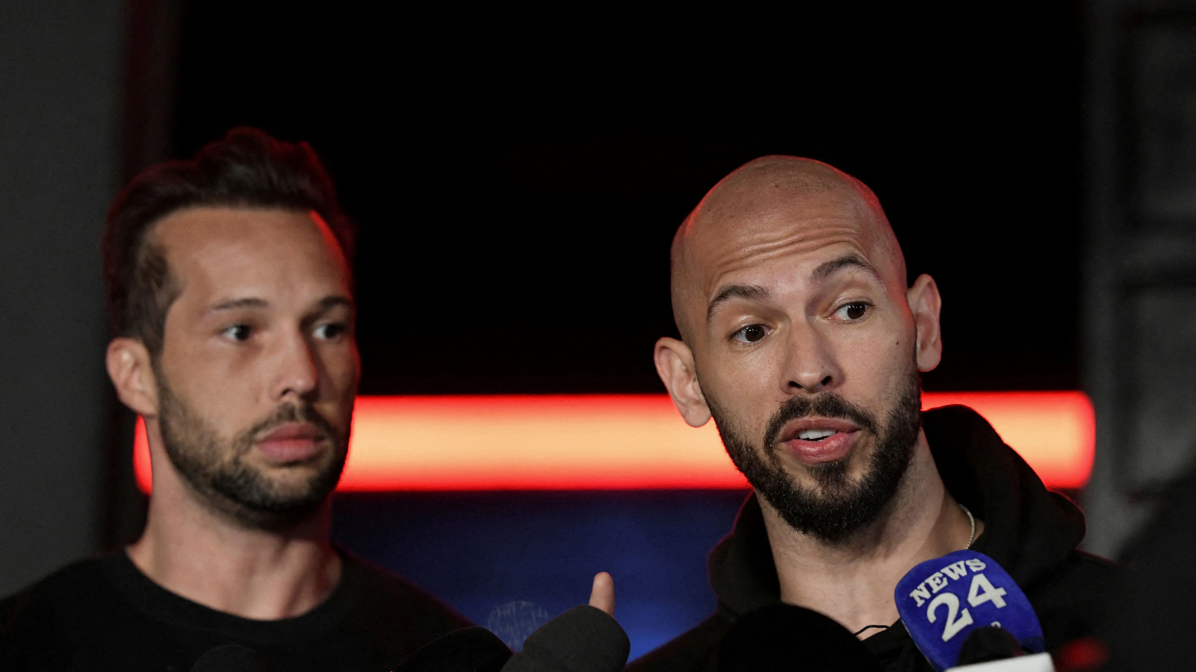 Tristan and Andrew Tate deliver a press statement in front of their house after landing back in Romania, near Bucharest, Romania, March 22, 2025. Inquam Photos/Eduard Vinatoru via REUTERS ATTENTION EDITORS - THIS IMAGE WAS PROVIDED BY A THIRD PARTY. ROMANIA OUT. NO COMMERCIAL OR EDITORIAL SALES IN ROMANIA