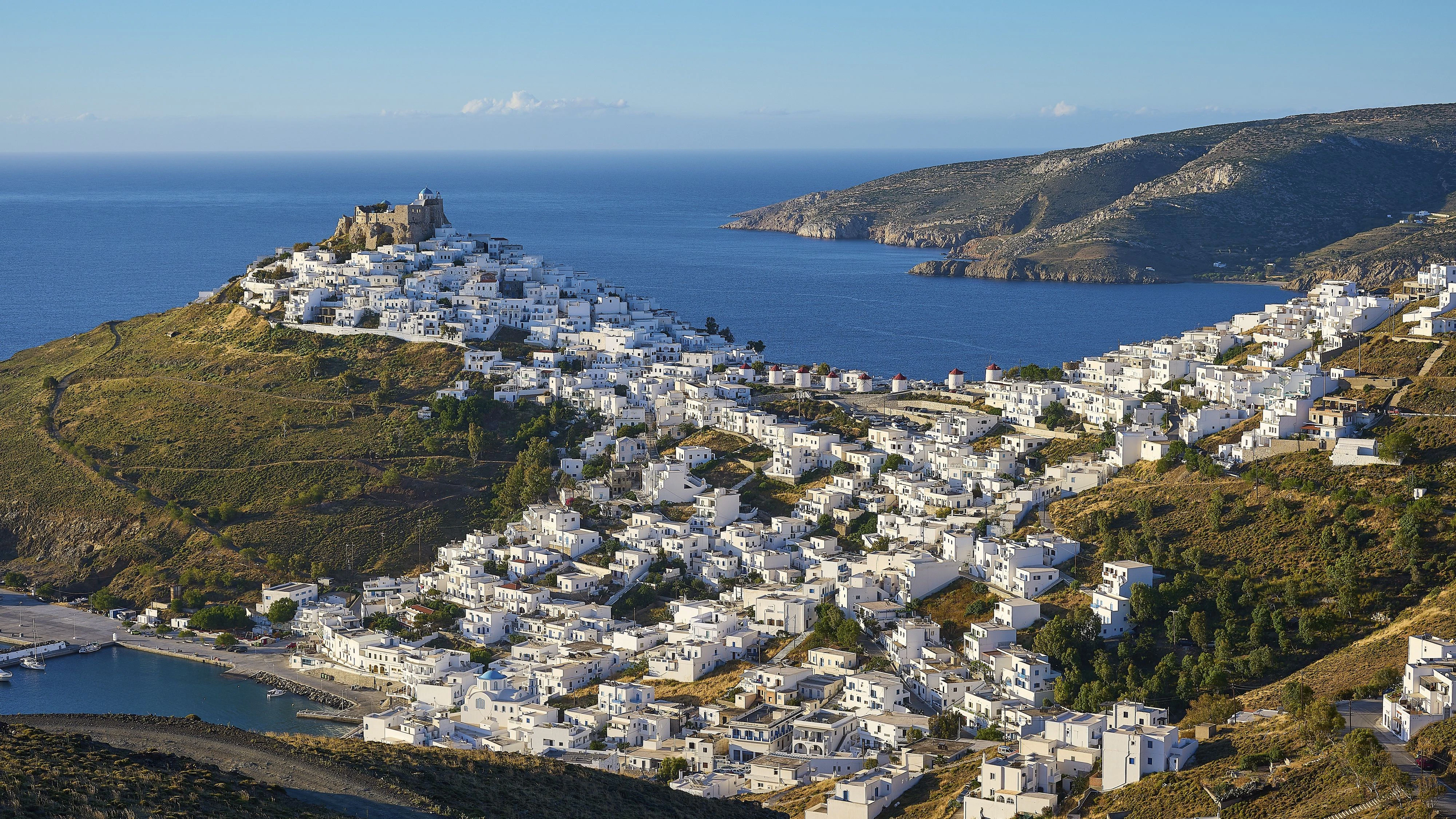 Whitewashed settlement stretches along a hill overlooking the blue Mediterranean, Querini Castle, Chora, Astypalea, Dodecanese, Greek Islands, Greece, Europe